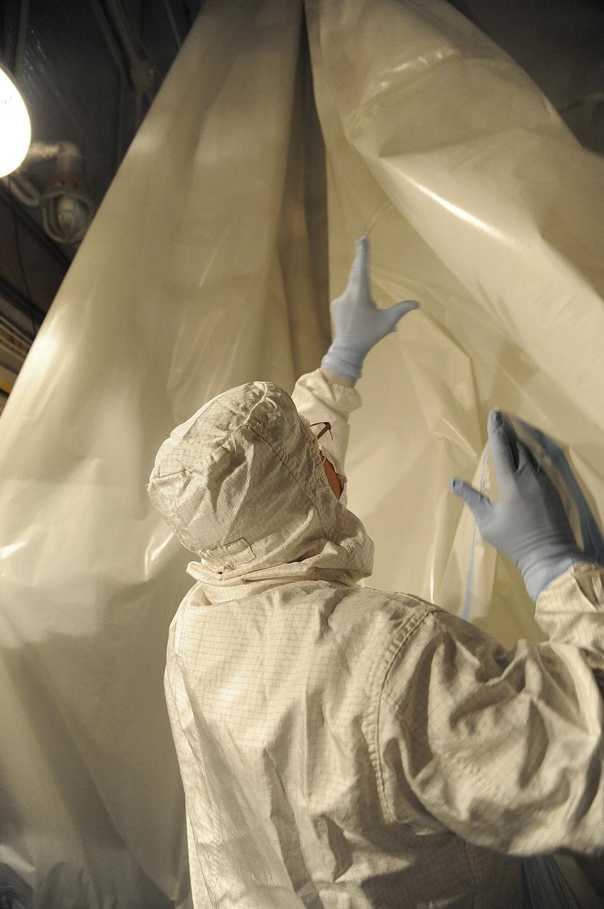 VANDENBERG AIR FORCE BASE, Calif. – In the mobile service tower at Space Launch Complex 2 at Vandenberg Air Force Base in California, technicians are inspecting the NASA's Orbiting Carbon Observatory-2, or OCO-2, satellite. The task is taking place prior to encapsulation in its payload fairing atop a United Launch Alliance Delta II rocket. Launch is scheduled for 2:56 a.m. PDT 5:56 a.m. EDT on July 1.      OCO-2 is NASA’s first mission dedicated to studying atmospheric carbon dioxide, the leading human-produced greenhouse gas driving changes in Earth’s climate. OCO-2 will provide a new tool for understanding the human and natural sources of carbon dioxide emissions and the natural "sinks" that absorb carbon dioxide and help control its buildup. The observatory will measure the global geographic distribution of these sources and sinks and study their changes over time. To learn more about OCO-2, visit http://oco.jpl.nasa.gov Photo credit: NASA/Mark Mackley