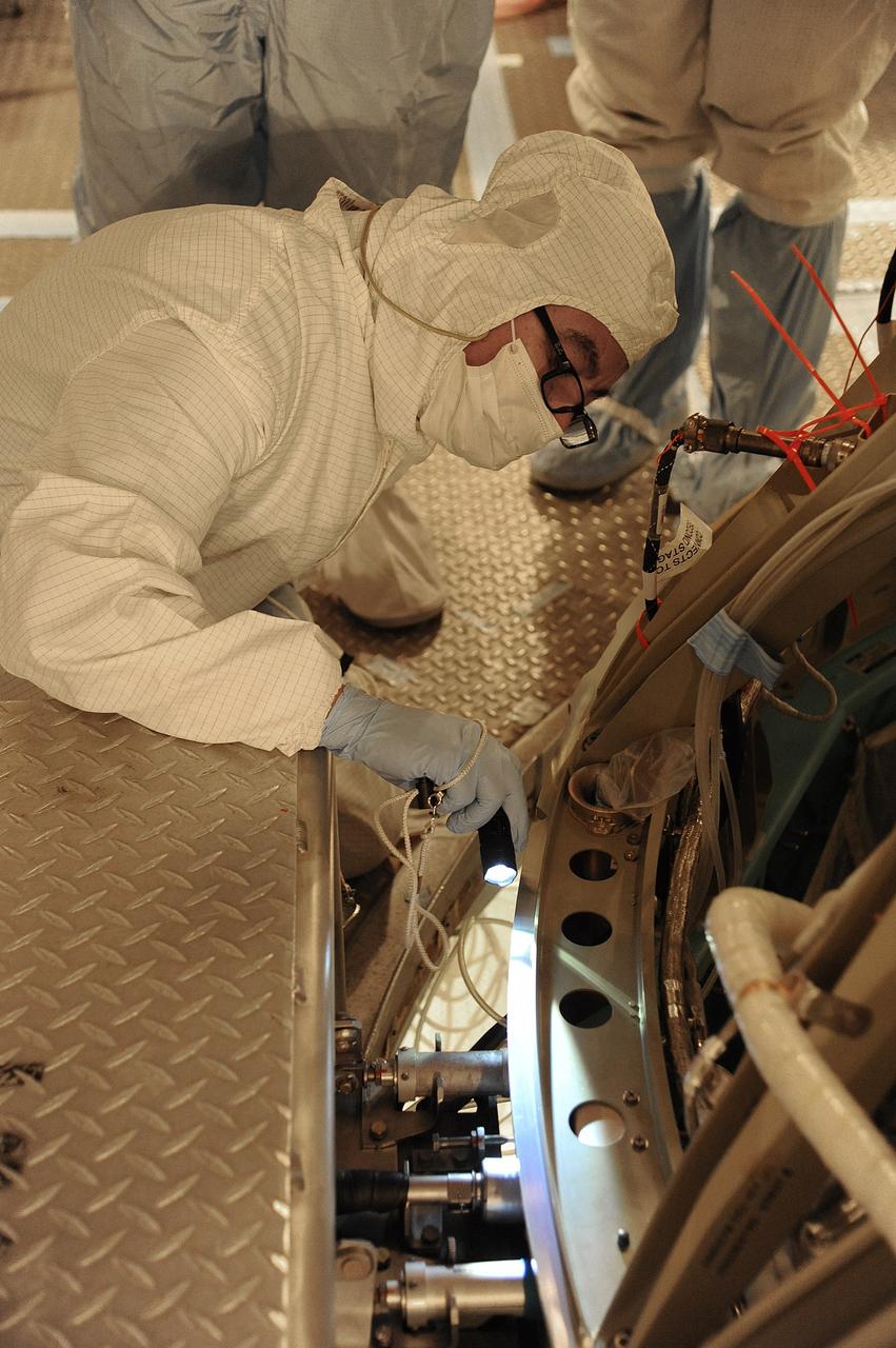 VANDENBERG AIR FORCE BASE, Calif. – In the mobile service tower at Space Launch Complex 2 at Vandenberg Air Force Base in California, technicians are inspecting the NASA's Orbiting Carbon Observatory-2, or OCO-2, satellite. The task is taking place prior to encapsulation in its payload fairing atop a United Launch Alliance Delta II rocket. Launch is scheduled for 2:56 a.m. PDT 5:56 a.m. EDT on July 1.        OCO-2 is NASA’s first mission dedicated to studying atmospheric carbon dioxide, the leading human-produced greenhouse gas driving changes in Earth’s climate. OCO-2 will provide a new tool for understanding the human and natural sources of carbon dioxide emissions and the natural "sinks" that absorb carbon dioxide and help control its buildup. The observatory will measure the global geographic distribution of these sources and sinks and study their changes over time. To learn more about OCO-2, visit http://oco.jpl.nasa.gov Photo credit: NASA/Mark Mackley