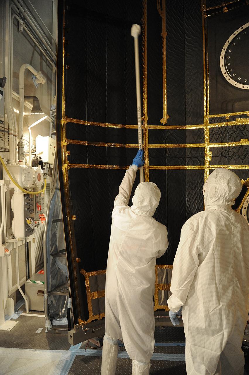 VANDENBERG AIR FORCE BASE, Calif. – In the mobile service tower at Space Launch Complex 2 at Vandenberg Air Force Base in California, technicians are inspecting the payload fairing for NASA's Orbiting Carbon Observatory-2, or OCO-2, satellite. The fairing will soon be used to encapsulate the satellite atop a United Launch Alliance Delta II rocket. Launch is scheduled for 2:56 a.m. PDT 5:56 a.m. EDT on July 1.        OCO-2 is NASA’s first mission dedicated to studying atmospheric carbon dioxide, the leading human-produced greenhouse gas driving changes in Earth’s climate. OCO-2 will provide a new tool for understanding the human and natural sources of carbon dioxide emissions and the natural "sinks" that absorb carbon dioxide and help control its buildup. The observatory will measure the global geographic distribution of these sources and sinks and study their changes over time. To learn more about OCO-2, visit http://oco.jpl.nasa.gov Photo credit: NASA/Mark Mackley