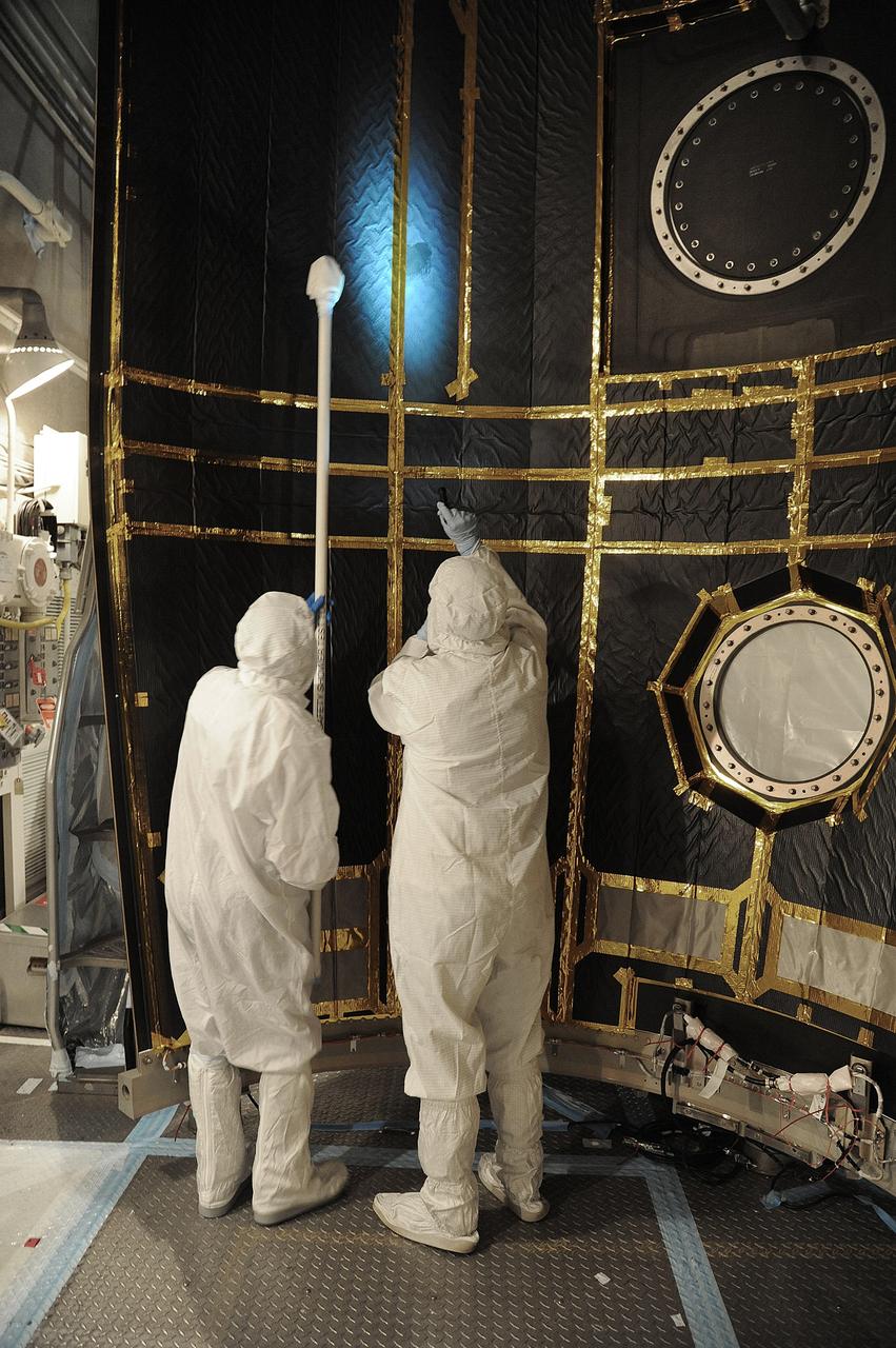 VANDENBERG AIR FORCE BASE, Calif. – In the mobile service tower at Space Launch Complex 2 at Vandenberg Air Force Base in California, technicians are inspecting the payload fairing for NASA's Orbiting Carbon Observatory-2, or OCO-2, satellite. The fairing will soon be used to encapsulate the satellite atop a United Launch Alliance Delta II rocket. Launch is scheduled for 2:56 a.m. PDT 5:56 a.m. EDT on July 1.        OCO-2 is NASA’s first mission dedicated to studying atmospheric carbon dioxide, the leading human-produced greenhouse gas driving changes in Earth’s climate. OCO-2 will provide a new tool for understanding the human and natural sources of carbon dioxide emissions and the natural "sinks" that absorb carbon dioxide and help control its buildup. The observatory will measure the global geographic distribution of these sources and sinks and study their changes over time. To learn more about OCO-2, visit http://oco.jpl.nasa.gov Photo credit: NASA/Mark Mackley