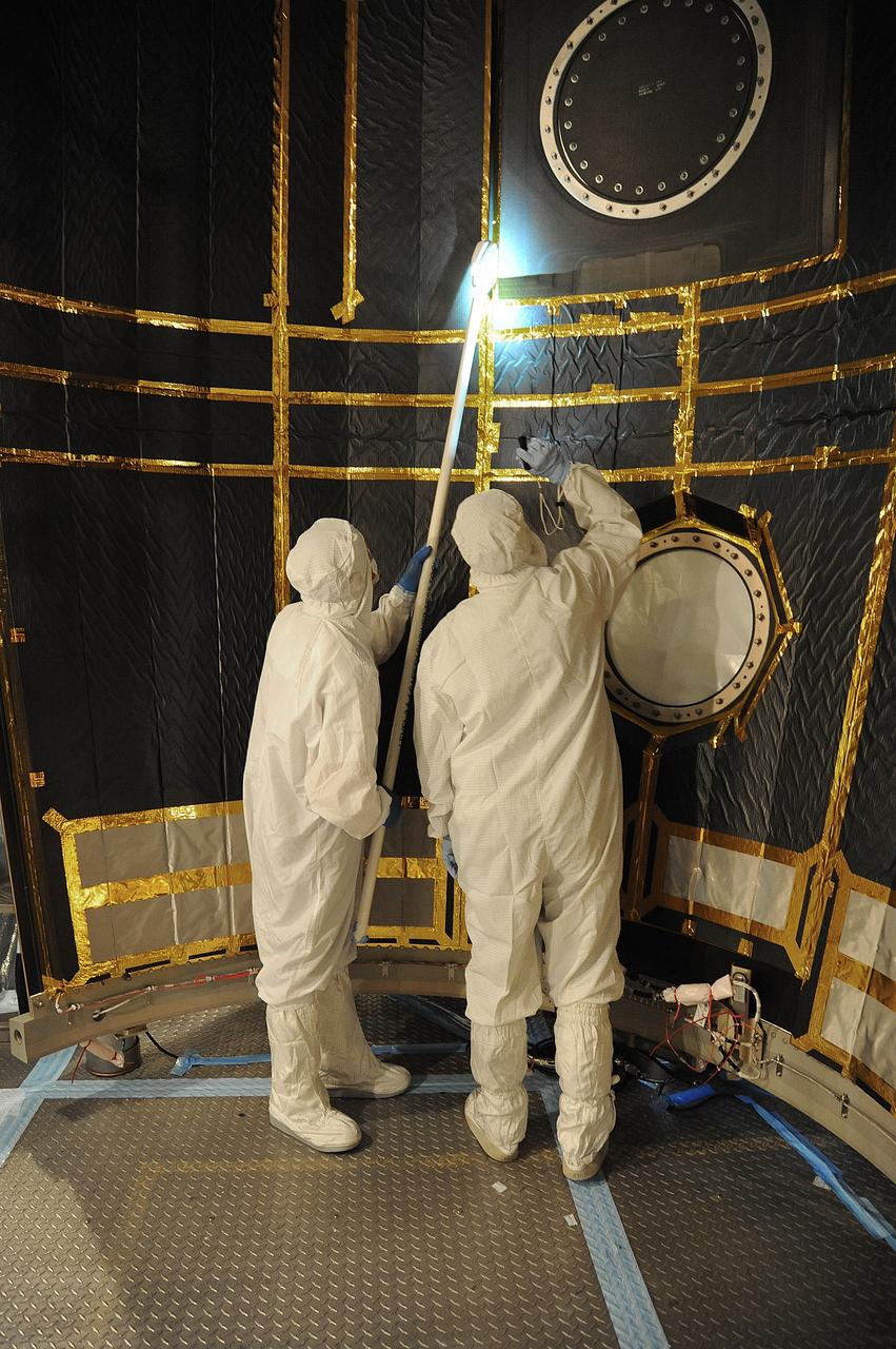 VANDENBERG AIR FORCE BASE, Calif. – In the mobile service tower at Space Launch Complex 2 at Vandenberg Air Force Base in California, technicians are inspecting the payload fairing for NASA's Orbiting Carbon Observatory-2, or OCO-2, satellite. The fairing will soon be used to encapsulate the satellite atop a United Launch Alliance Delta II rocket. Launch is scheduled for 2:56 a.m. PDT 5:56 a.m. EDT on July 1.        OCO-2 is NASA’s first mission dedicated to studying atmospheric carbon dioxide, the leading human-produced greenhouse gas driving changes in Earth’s climate. OCO-2 will provide a new tool for understanding the human and natural sources of carbon dioxide emissions and the natural "sinks" that absorb carbon dioxide and help control its buildup. The observatory will measure the global geographic distribution of these sources and sinks and study their changes over time. To learn more about OCO-2, visit http://oco.jpl.nasa.gov Photo credit: NASA/Mark Mackley