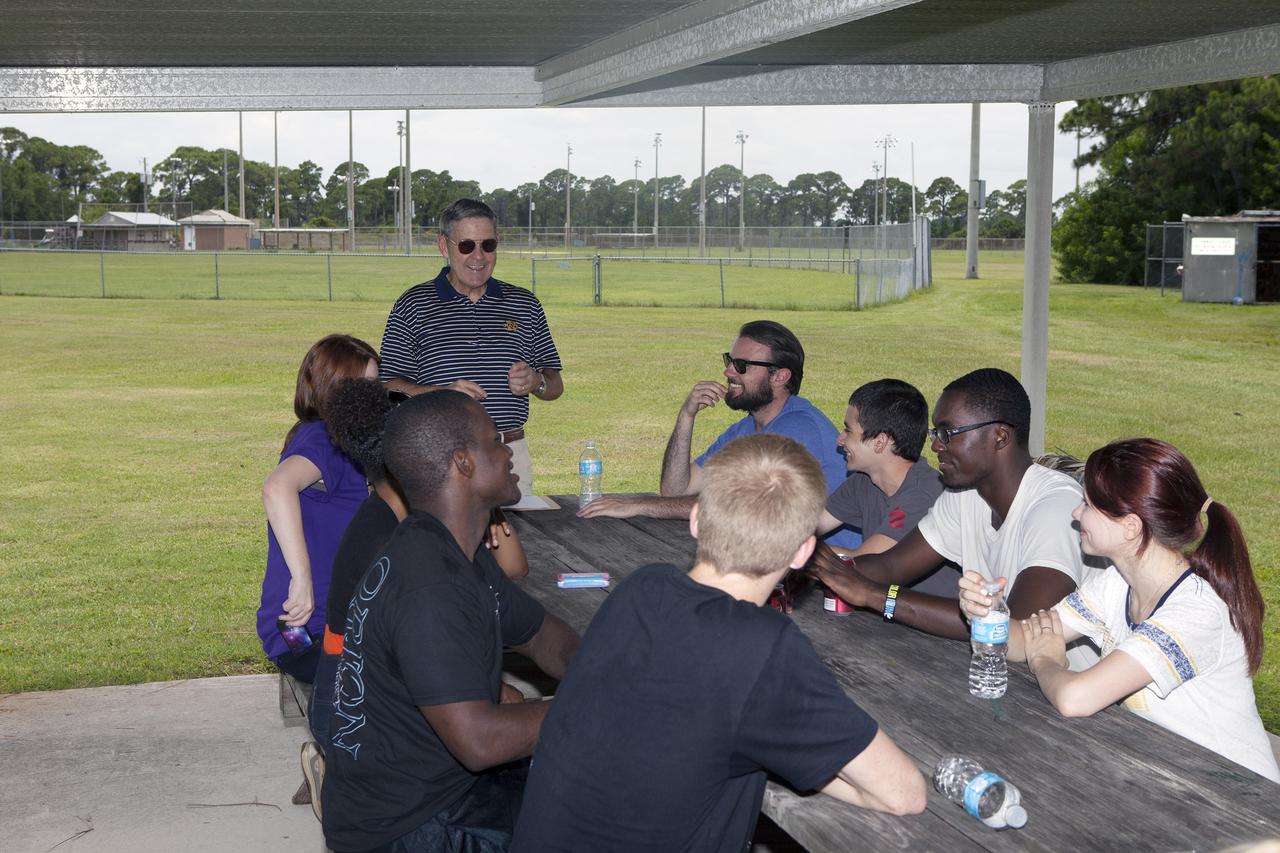 CAPE CANAVERAL, Fla. – Kennedy Space Center Director Bob Cabana talks to student interns during an event at the KARS Park I facility near the center. High school, undergraduate and graduate students participate in a team building exercise and received advice on leadership skills and working together from Kennedy's senior management.    About 160 students are working and gaining experience in many of the directorates and programs during their time at Kennedy. Photo credit: NASA/Daniel Casper