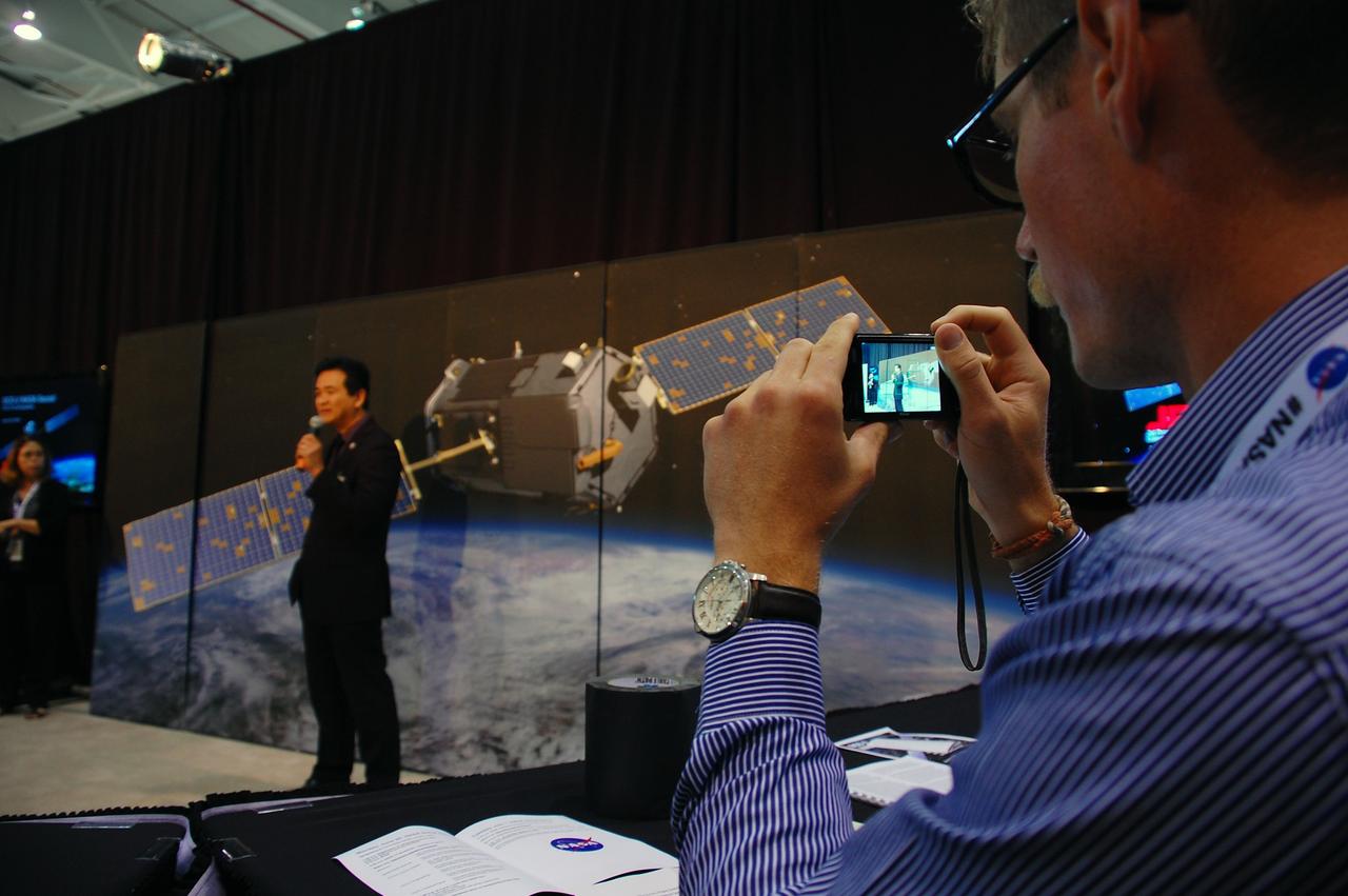 VANDENBERG AIR FORCE BASE, Calif. – Ralph Basilio, project manager for NASA's Orbiting Carbon Observatory-2 from NASA's Jet Propulsion Laboratory, discusses the observatory, or OCO-2, with representatives of social media outlets attending a NASA Social at Vandenberg Air Force Base in California. Launch of OCO-2 aboard a United Launch Alliance Delta II rocket from Space Launch Complex 2 is scheduled for 5:56 a.m. EDT on July 1. The social media users selected to attend the two-day event on June 30 and July 1 are given the same access as news media in an effort to align their experience with those of traditional media. OCO-2 is NASA’s first mission dedicated to studying atmospheric carbon dioxide, the leading human-produced greenhouse gas driving changes in Earth’s climate. OCO-2 will provide a new tool for understanding the human and natural sources of carbon dioxide emissions and the natural "sinks" that absorb carbon dioxide and help control its buildup. The observatory will measure the global geographic distribution of these sources and sinks and study their changes over time. To learn more about OCO-2, visit http://www.nasa.gov/oco2. Photo credit: NASA/Ben Smegelsky