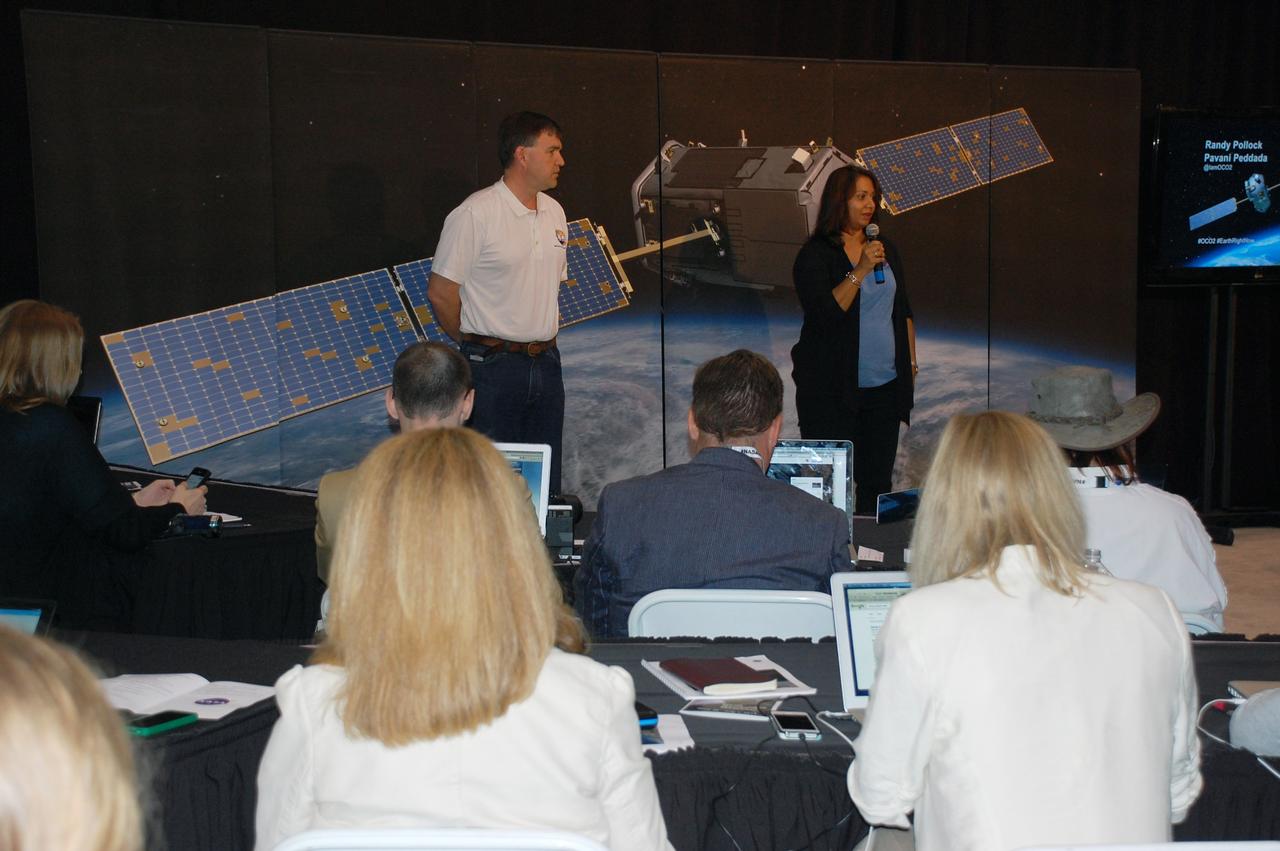 VANDENBERG AIR FORCE BASE, Calif. – Randy Pollock, project architect for NASA's Orbiting Carbon Observatory-2, or OCO-2, from NASA's Jet Propulsion Laboratory, or JPL, and Pavani Peddada, OCO-2 engineer from JPL, discuss the observatory with representatives of social media outlets attending a NASA Social at Vandenberg Air Force Base in California.    Launch of OCO-2 aboard a United Launch Alliance Delta II rocket from Space Launch Complex 2 is scheduled for 5:56 a.m. EDT on July 1. The social media users selected to attend the two-day event on June 30 and July 1 are given the same access as news media in an effort to align their experience with those of traditional media.  OCO-2 is NASA’s first mission dedicated to studying atmospheric carbon dioxide, the leading human-produced greenhouse gas driving changes in Earth’s climate. OCO-2 will provide a new tool for understanding the human and natural sources of carbon dioxide emissions and the natural "sinks" that absorb carbon dioxide and help control its buildup. The observatory will measure the global geographic distribution of these sources and sinks and study their changes over time. To learn more about OCO-2, visit http://www.nasa.gov/oco2.  Photo credit: NASA/Ben Smegelsky