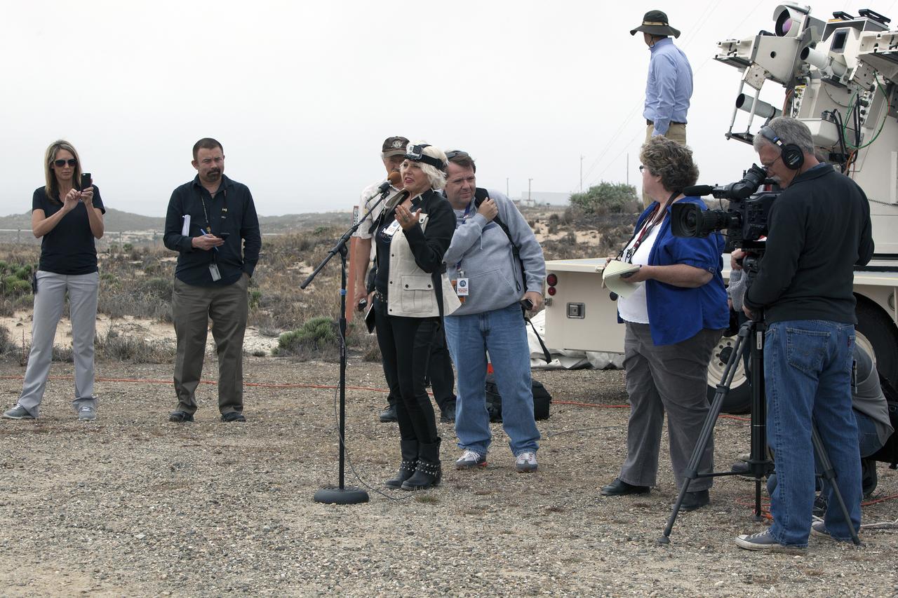 VANDENBERG AIR FORCE BASE, Calif. – News media representatives converge on Space Launch Complex 2 at Vandenberg Air Force Base in California to cover the launch of NASA's Orbiting Carbon Observatory-2, or OCO-2.    Final preparations for launch of OCO-2 at 5:56 a.m. EDT on July 1 aboard a United Launch Alliance Delta II rocket are underway on the pad.  OCO-2 is NASA’s first mission dedicated to studying atmospheric carbon dioxide, the leading human-produced greenhouse gas driving changes in Earth’s climate. OCO-2 will provide a new tool for understanding the human and natural sources of carbon dioxide emissions and the natural "sinks" that absorb carbon dioxide and help control its buildup. The observatory will measure the global geographic distribution of these sources and sinks and study their changes over time. To learn more about OCO-2, visit http://www.nasa.gov/oco2.  Photo credit: NASA/Ben Smegelsky