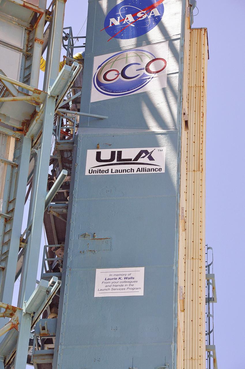 VANDENBERG AIR FORCE BASE, Calif. – A memorial plaque honoring Laurie K. Walls is affixed to the umbilical tower on Space Launch Complex 2 at Vandenberg Air Force Base in California for the launch of NASA's Orbiting Carbon Observatory-2, or OCO-2. Walls, a thermal analysis engineer with the Launch Services Program, or LSP, at NASA's Kennedy Space Center, died June 4. This dedication to Walls from the members of the launch team was read during the OCO-2 countdown commentary: "The OCO-2 mission has special meaning to NASA's Launch Services Program as we have dedicated it to one of our LSP Teammates, Laurie Walls. Laurie began her career over 30 years ago as a thermal engineer for McDonnell Douglas in Huntsville, Alabama, supporting NASA's Marshall Space Flight Center. She moved to Florida in 1985. Shortly after coming to Florida, Laurie became a civil servant working on the Shuttle program return to flight effort post-Challenger. In 1998, Laurie joined the newly formed Launch Services Program as one of the founding members of the flight analysis group. She served in LSP as the thermal discipline expert until her untimely death earlier this month. Laurie worked thermal issues for numerous NASA Delta II and Atlas V missions. Additionally, she provided key thermal support for both Delta II Heavy development and Atlas V Certification. Laurie was an integral member of LSP's family and she was truly dedicated to NASA and the LSP team. She will be greatly missed. We honor Laurie with a special memorial placed on the SLC-2 umbilical tower, and we thank ULA for helping to make this happen."     Launch of OCO-2 is scheduled for 5:56 a.m. EDT on July 1. To learn more about NASA's Launch Services Program, visit http://www.nasa.gov/centers/kennedy/launchingrockets/index.html.  Photo credit: NASA/Randy Beaudoin