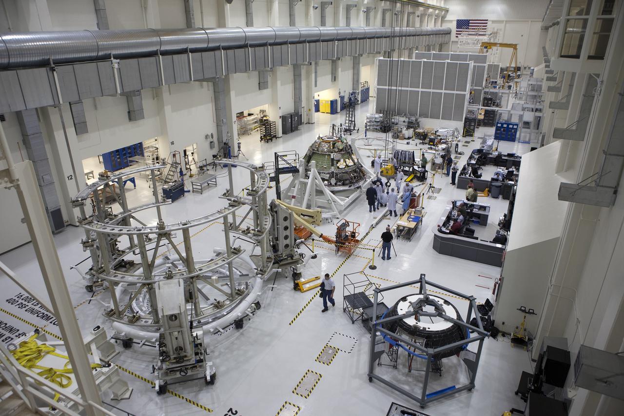 CAPE CANAVERAL, Fla. – Inside the Operations and Checkout Building high bay at NASA's Kennedy Space Center in Florida, NASA and Lockheed Martin technicians and engineers prepare to conduct a center of gravity, or CG, test on the Orion crew module. The CG tool will measure the exact location of the vehicle's center of gravity. This test is important as it affects the handling and control characteristics of the vehicle. The Orion crew module will be stacked on the service module in the Final Assembly and System Testing, or FAST, cell and then both modules will be put through their final system tests for Exploration Flight Test-1, or EFT-1, before rolling out of the facility for integration with the United Launch Alliance Delta IV Heavy rocket. Orion is the exploration spacecraft designed to carry astronauts to destinations not yet explored by humans, including an asteroid and Mars. It will have emergency abort capability, sustain the crew during space travel and provide safe re-entry from deep space return velocities. The first unpiloted test flight of Orion, EFT-1, is scheduled to launch later this year atop a Delta IV rocket from Cape Canaveral Air Force Station in Florida to an altitude of 3,600 miles above the Earth's surface. The two-orbit, four-hour flight test will help engineers evaluate the systems critical to crew safety including the heat shield, parachute system and launch abort system. For more information, visit http://www.nasa.gov/orion. Photo credit: NASA/Kim Shiflett