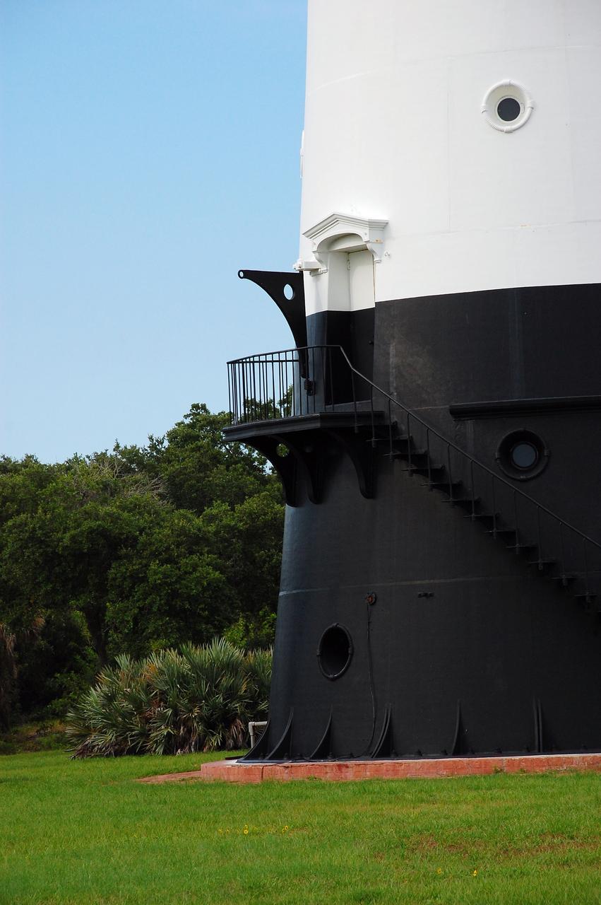 CAPE CANAVERAL, Fla. -- The historic Cape Canaveral Light, now owned by the U.S. Air Force, has resided in its current spot on Cape Canaveral Air Force Station in Florida since 1894. The first lighthouse on Cape Canaveral was built near the tip of the Cape in 1848. The structure was only about 60 feet high with a rather dim light powered by whale oil. In 1859, work began nearby on a new, taller iron structure. Construction was halted during the Civil War, and the lighthouse was not finished until 1868. The structure, with a brick lining inside its iron exterior, was painted with its "daymark" black and white horizontal bands in 1873 to make it easier to identify during the day as a navigation point. Between 1892 and 1894, the lighthouse was dismantled and moved to a new location about a mile from the coast, where it stands today. For more information on the lighthouse, visit http://www.nasa.gov/centers/kennedy/about/history/lighthouse.html. Photo credit: NASA/Ben Smegelsky