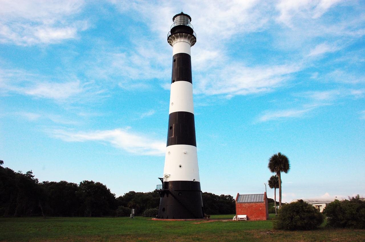 CAPE CANAVERAL, Fla. -- Reconstruction from the original architectural plans of the keeper's house, next to the historic Cape Canaveral Light on Cape Canaveral Air Force Station in Florida, is planned by the Cape Canaveral Lighthouse Foundation. The lighthouse currently is owned by the U.S. Air Force. The first lighthouse on Cape Canaveral was built near the tip of the Cape in 1848. The structure was only about 60 feet high with a rather dim light powered by whale oil. In 1859, work began nearby on a new, taller iron structure. Construction was halted during the Civil War, and the lighthouse was not finished until 1868. The structure, with a brick lining inside its iron exterior, was painted with its "daymark" black and white horizontal bands in 1873 to make it easier to identify during the day as a navigation point. Between 1892 and 1894, the lighthouse was dismantled and moved to a new location about a mile from the coast, where it stands today. For more information on the lighthouse, visit http://www.nasa.gov/centers/kennedy/about/history/lighthouse.html. Photo credit: NASA/Ben Smegelsky