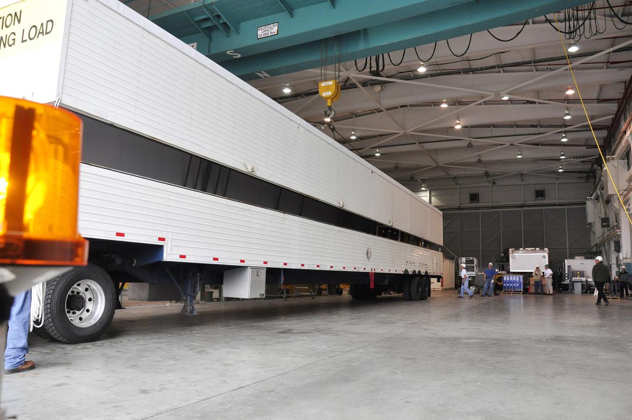 VANDENBERG AIR FORCE BASE, Calif. – The transportation trailer carrying the second stage, or upper stage, of a United Launch Alliance Delta II rocket backs into the Building 836 hangar on south Vandenberg Air Force Base in California. The Delta II rocket will be used to deliver NASA's Soil Moisture Active Passive mission, or SMAP, into orbit from Vandenberg's Space Launch Complex 2. SMAP will provide global measurements of soil moisture and its freeze/thaw state. These measurements will be used to enhance understanding of processes that link the water, energy and carbon cycles, and to extend the capabilities of weather and climate prediction models. SMAP data also will be used to quantify net carbon flux in boreal landscapes and to develop improved flood prediction and drought monitoring capabilities. Launch is scheduled for November 2014. To learn more about SMAP, visit http://smap.jpl.nasa.gov. Photo credit: NASA/Randy Beaudoin