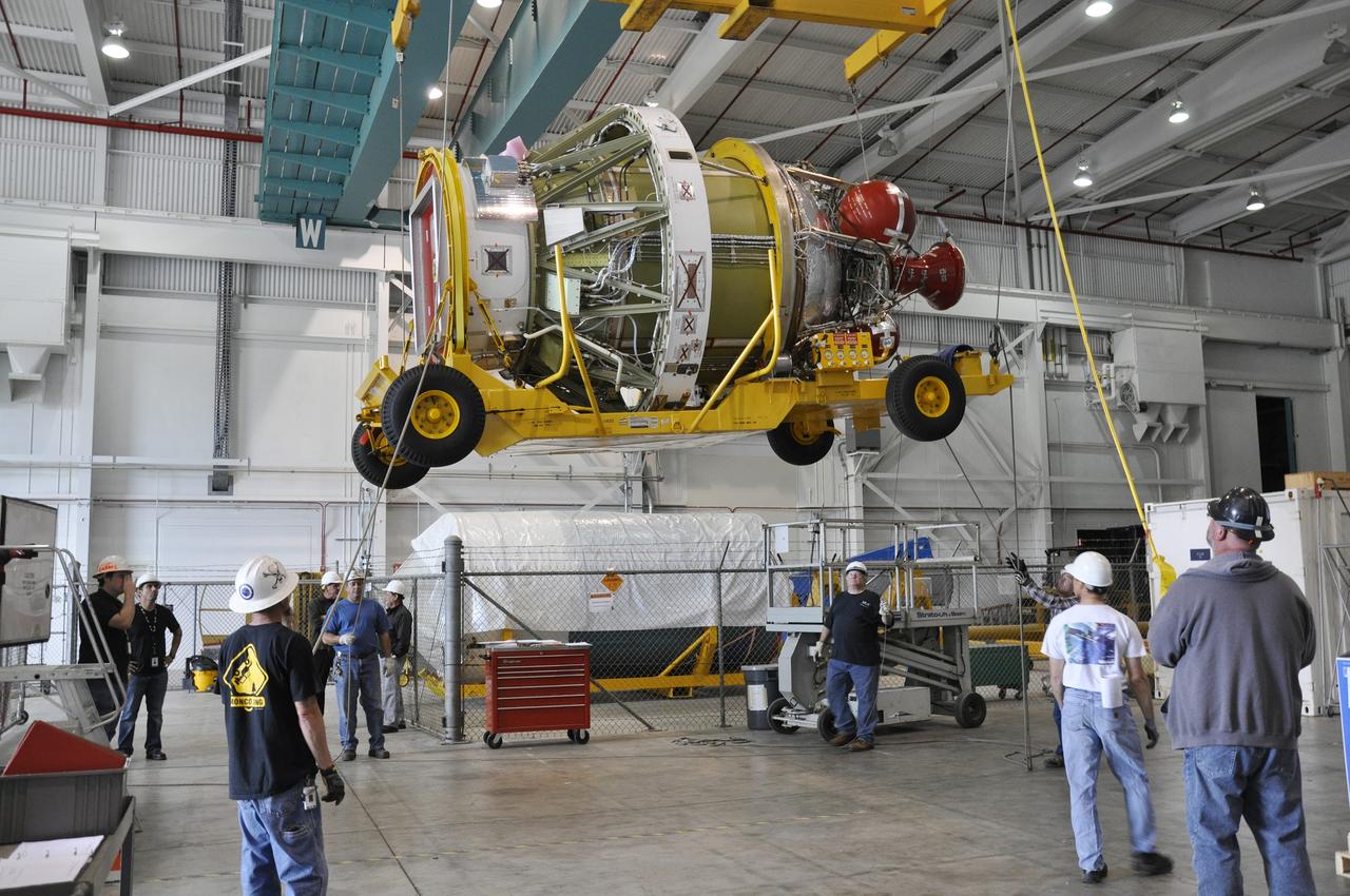 VANDENBERG AIR FORCE BASE, Calif. – The second stage, or upper stage, of a United Launch Alliance Delta II rocket and the transporter to which it is attached are lifted out of a transportation trailer in the Building 836 hangar on south Vandenberg Air Force Base in California. The stage will be moved to the Horizontal Integration Facility at Space Launch Complex 2 for further processing. The Delta II rocket will be used to deliver NASA's Soil Moisture Active Passive mission, or SMAP, into orbit. SMAP will provide global measurements of soil moisture and its freeze/thaw state. These measurements will be used to enhance understanding of processes that link the water, energy and carbon cycles, and to extend the capabilities of weather and climate prediction models. SMAP data also will be used to quantify net carbon flux in boreal landscapes and to develop improved flood prediction and drought monitoring capabilities. Launch is scheduled for November 2014. To learn more about SMAP, visit http://smap.jpl.nasa.gov. Photo credit: NASA/Randy Beaudoin