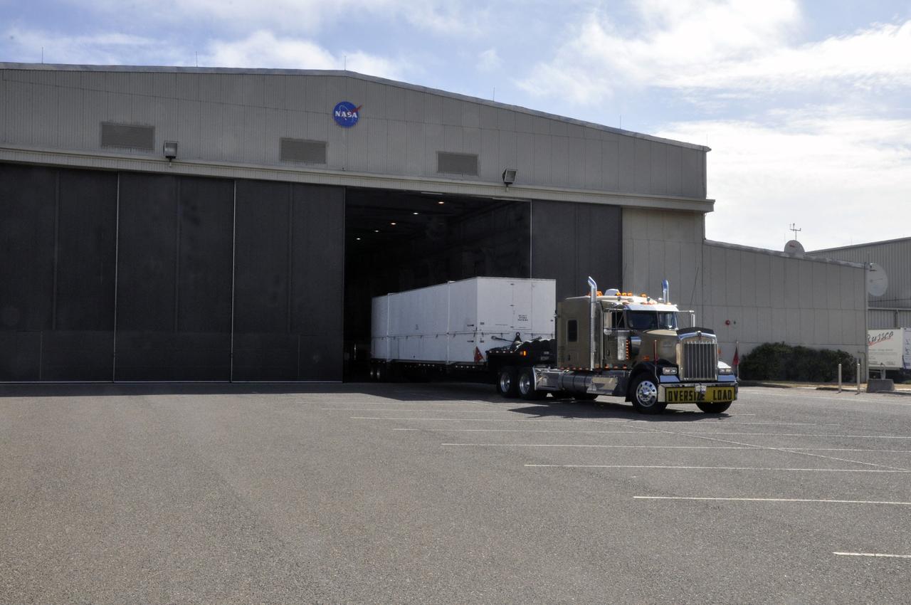 VANDENBERG AIR FORCE BASE, Calif. –The interstage adapter, or ISA, for NASA's Soil Moisture Active Passive mission, or SMAP, arrives at the Building 836 hangar on south Vandenberg Air Force Base in California.     A United Launch Alliance Delta II rocket will loft SMAP into orbit from Vandenberg's Space Launch Complex 2. The ISA connects the Delta II first and second stages and encloses the second stage engine and thrust section. The spacecraft will provide global measurements of soil moisture and its freeze/thaw state. These measurements will be used to enhance understanding of processes that link the water, energy and carbon cycles, and to extend the capabilities of weather and climate prediction models. The data returned also will be used to quantify net carbon flux in boreal landscapes and to develop improved flood prediction and drought monitoring capabilities. Launch is scheduled for November 2014. To learn more about SMAP, visit http://smap.jpl.nasa.gov.  Photo credit: NASA/Randy Beaudoin