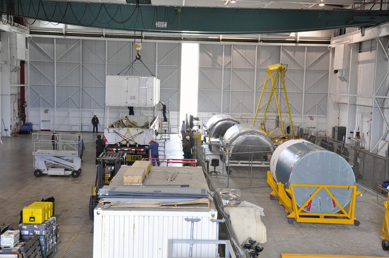 VANDENBERG AIR FORCE BASE, Calif. – The canister containing the interstage adapter, or ISA, for NASA's Soil Moisture Active Passive mission, or SMAP, awaits further processing following its arrival in the high bay of the Building 836 hangar on south Vandenberg Air Force Base in California.     A United Launch Alliance Delta II rocket will loft SMAP into orbit from Vandenberg's Space Launch Complex 2. The ISA connects the Delta II first and second stages and encloses the second stage engine and thrust section. The spacecraft will provide global measurements of soil moisture and its freeze/thaw state. These measurements will be used to enhance understanding of processes that link the water, energy and carbon cycles, and to extend the capabilities of weather and climate prediction models. The data returned also will be used to quantify net carbon flux in boreal landscapes and to develop improved flood prediction and drought monitoring capabilities. Launch is scheduled for November 2014. To learn more about SMAP, visit http://smap.jpl.nasa.gov.  Photo credit: NASA/Randy Beaudoin