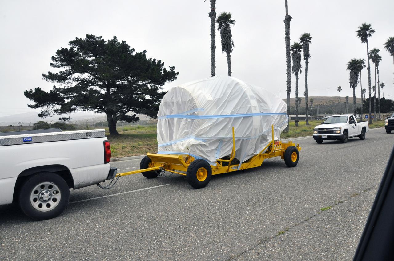 VANDENBERG AIR FORCE BASE, Calif. – The second stage, or upper stage, of a United Launch Alliance Delta II rocket is on its way from Building 836 on south Vandenberg Air Force Base in California to the Horizontal Processing Facility at Space Launch Complex 2. The Delta II rocket will be used to deliver NASA's Soil Moisture Active Passive mission, or SMAP, into orbit. SMAP will provide global measurements of soil moisture and its freeze/thaw state. These measurements will be used to enhance understanding of processes that link the water, energy and carbon cycles, and to extend the capabilities of weather and climate prediction models. SMAP data also will be used to quantify net carbon flux in boreal landscapes and to develop improved flood prediction and drought monitoring capabilities. Launch is scheduled for November 2014. To learn more about SMAP, visit http://smap.jpl.nasa.gov. Photo credit: NASA/Randy Beaudoin