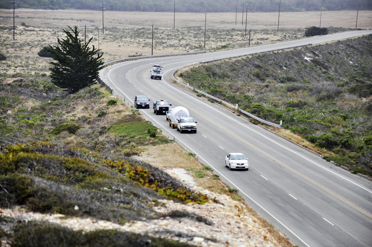 VANDENBERG AIR FORCE BASE, Calif. – The second stage, or upper stage, of a United Launch Alliance Delta II rocket winds its way along the roads from Building 836 to the Horizontal Processing Facility at Space Launch Complex 2 on Vandenberg Air Force Base in California.    The Delta II rocket will be used to deliver NASA's Soil Moisture Active Passive mission, or SMAP, into orbit. SMAP will provide global measurements of soil moisture and its freeze/thaw state. These measurements will be used to enhance understanding of processes that link the water, energy and carbon cycles, and to extend the capabilities of weather and climate prediction models. SMAP data also will be used to quantify net carbon flux in boreal landscapes and to develop improved flood prediction and drought monitoring capabilities. Launch is scheduled for November 2014. To learn more about SMAP, visit http://smap.jpl.nasa.gov.  Photo credit: NASA/Randy Beaudoin