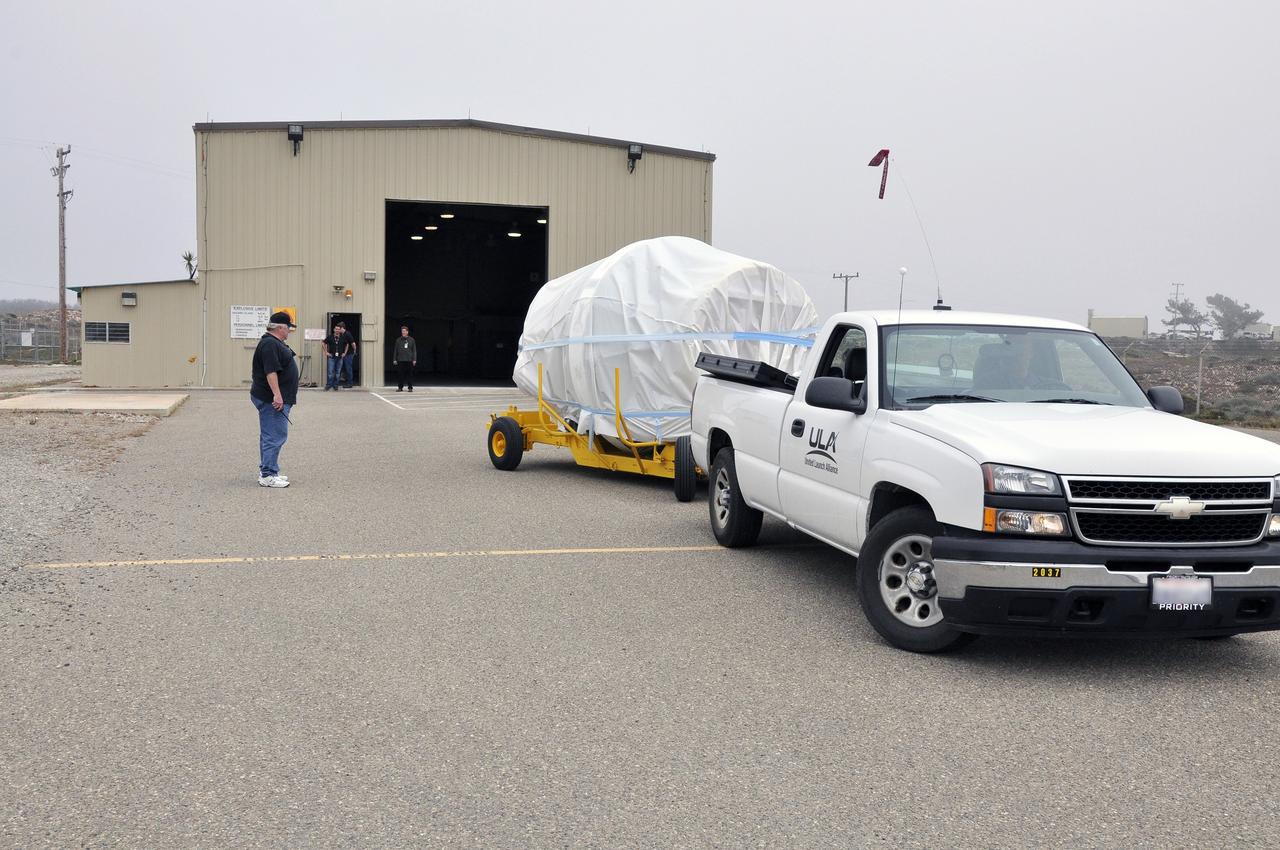 VANDENBERG AIR FORCE BASE, Calif. – The second stage, or upper stage, of a United Launch Alliance Delta II rocket arrives at the Horizontal Processing Facility at Space Launch Complex 2 on Vandenberg Air Force Base in California.      The Delta II rocket will be used to deliver NASA's Soil Moisture Active Passive mission, or SMAP, into orbit. SMAP will provide global measurements of soil moisture and its freeze/thaw state. These measurements will be used to enhance understanding of processes that link the water, energy and carbon cycles, and to extend the capabilities of weather and climate prediction models. SMAP data also will be used to quantify net carbon flux in boreal landscapes and to develop improved flood prediction and drought monitoring capabilities. Launch is scheduled for November 2014. To learn more about SMAP, visit http://smap.jpl.nasa.gov.  Photo credit: NASA/Randy Beaudoin
