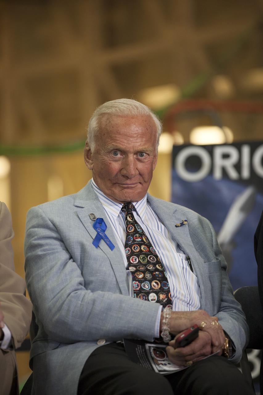 CAPE CANAVERAL, Fla. -- At the Kennedy Space Center in Florida, Apollo 11 astronaut Buzz Aldrin participates in a ceremony renaming the refurbished Operations and Checkout Building for Apollo 11 astronaut Neil Armstrong, the first person to set foot on the moon. The building's high bay is being used to support the agency's new Orion spacecraft and is the same spaceport facility where the Apollo 11 command/service module and lunar module were prepped for the first lunar landing mission in 1969. Orion is designed to take humans farther than they’ve ever gone before, serving as the exploration vehicle that will carry astronauts to deep space and sustain the crew during travel to destinations such as an asteroid or Mars. The ceremony was part of NASA's 45th anniversary celebration of the Apollo 11 moon landing. As the world watched, Neil Armstrong and Buzz Aldrin landed in the moon's Sea of Tranquility on July 20, 1969, aboard the lunar module Eagle. Meanwhile, crewmate Michael Collins orbited above in the command module Columbia. For more, visit http://www.nasa.gov/press/2014/july/nasa-honors-historic-first-moon-landing-eyes-first-mars-mission. Photo credit: NASA/Kim Shiflett