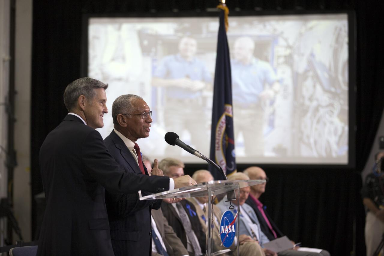 CAPE CANAVERAL, Fla. -- At the Kennedy Space Center in Florida, Center Director Robert Cabana, left, and NASA Administrator Charles Bolden participate a ceremony renaming the refurbished Operations and Checkout Building for Apollo 11 astronaut Neil Armstrong, the first person to set foot on the moon. The building's high bay is being used to support the agency's new Orion spacecraft and is the same spaceport facility where the Apollo 11 command/service module and lunar module were prepped for the first lunar landing mission in 1969. Orion is designed to take humans farther than they’ve ever gone before, serving as the exploration vehicle that will carry astronauts to deep space and sustain the crew during travel to destinations such as an asteroid or Mars. The ceremony was part of NASA's 45th anniversary celebration of the Apollo 11 moon landing. As the world watched, Neil Armstrong and Buzz Aldrin landed in the moon's Sea of Tranquility on July 20, 1969, aboard the lunar module Eagle. Meanwhile, crewmate Michael Collins orbited above in the command module Columbia. For more, visit http://www.nasa.gov/press/2014/july/nasa-honors-historic-first-moon-landing-eyes-first-mars-mission. Photo credit: NASA/Kim Shiflett