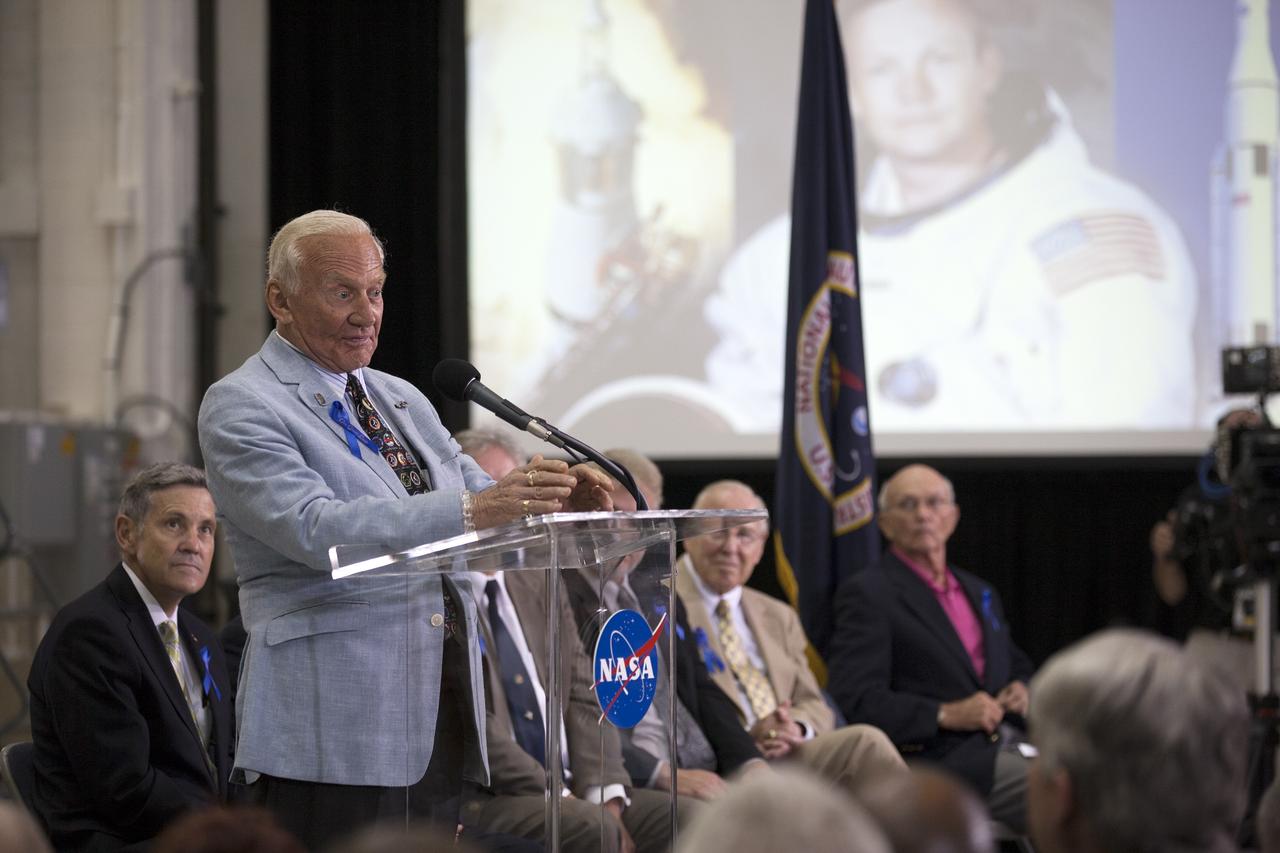 CAPE CANAVERAL, Fla. -- At the Kennedy Space Center in Florida, Apollo 11 astronaut Buzz Aldrin addresses the audience at a ceremony renaming the refurbished Operations and Checkout Building for Apollo 11 astronaut Neil Armstrong, the first person to set foot on the moon. The building's high bay is being used to support the agency's new Orion spacecraft and is the same spaceport facility where the Apollo 11 command/service module and lunar module were prepped for the first lunar landing mission in 1969. Orion is designed to take humans farther than they’ve ever gone before, serving as the exploration vehicle that will carry astronauts to deep space and sustain the crew during travel to destinations such as an asteroid or Mars. The ceremony was part of NASA's 45th anniversary celebration of the Apollo 11 moon landing. As the world watched, Neil Armstrong and Buzz Aldrin landed in the moon's Sea of Tranquility on July 20, 1969, aboard the lunar module Eagle. Meanwhile, crewmate Michael Collins orbited above in the command module Columbia. For more, visit http://www.nasa.gov/press/2014/july/nasa-honors-historic-first-moon-landing-eyes-first-mars-mission. Photo credit: NASA/Kim Shiflett