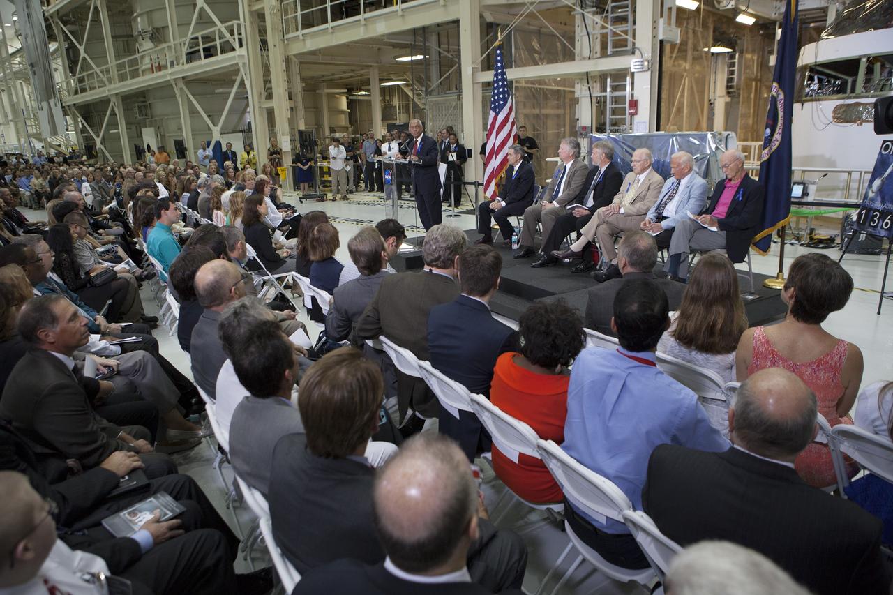 CAPE CANAVERAL, Fla. -- At the Kennedy Space Center in Florida, NASA Administrator Charles Bolden addresses the audience at a ceremony renaming the refurbished Operations and Checkout Building for Apollo 11 astronaut Neil Armstrong, the first person to set foot on the moon. Also participating in the ceremony are, from left, Center Director Robert Cabana, Armstrong's son Rick, Armstrong's son Mark, Apollo astronaut Jim Lovell, Apollo 11 astronaut Buzz Aldrin, and Apollo 11 astronaut Michael Collins. The building's high bay is being used to support the agency's new Orion spacecraft and is the same spaceport facility where the Apollo 11 command/service module and lunar module were prepped for the first lunar landing mission in 1969. Orion is designed to take humans farther than they’ve ever gone before, serving as the exploration vehicle that will carry astronauts to deep space and sustain the crew during travel to destinations such as an asteroid or Mars.    The ceremony was part of NASA's 45th anniversary celebration of the Apollo 11 moon landing. As the world watched, Neil Armstrong and Buzz Aldrin landed in the moon's Sea of Tranquility on July 20, 1969, aboard the lunar module Eagle. Meanwhile, crewmate Michael Collins orbited above in the command module Columbia. For more, visit http://www.nasa.gov/press/2014/july/nasa-honors-historic-first-moon-landing-eyes-first-mars-mission. Photo credit: NASA/Kim Shiflett