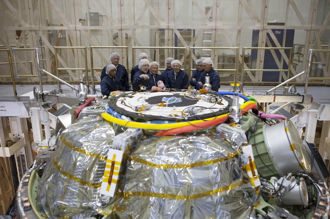 CAPE CANAVERAL, Fla. -- At the Kennedy Space Center in Florida, NASA officials and Apollo astronauts tour the refurbished Operations and Checkout Building, newly named for Apollo 11 astronaut Neil Armstrong, the first person to set foot on the moon. Viewing the Orion crew module stacked on top of the service module from left, are NASA Administrator Charlie Bolden, Rick Armstrong, Mark Geyer, Orion Program manager, Apollo 11 astronaut Buzz Aldrin, and Apollo astronaut Jim Lovell. Behind Lovell is Mark Armstrong, Kennedy Center Director Bob Cabana, and Apollo 11 astronaut Michael Collins. Partially hidden behind Geyer is Scott Wilson, manager, production operations for the Orion Program. The building's high bay is being used to support the agency's new Orion spacecraft, which will lift off atop the Space Launch System. Orion is designed to take humans farther than they've ever gone before, serving as the exploration vehicle that will carry astronauts to deep space and sustain the crew during travel to destinations such as an asteroid or Mars.     The visit of the former astronauts was part of NASA's 45th anniversary celebration of the moon landing. As the world watched, Neil Armstrong and Aldrin landed in the moon's Sea of Tranquility aboard the lunar module Eagle on July 20, 1969. Meanwhile, crewmate Collins orbited above in the command module Columbia. For more, visit http://www.nasa.gov/press/2014/july/nasa-honors-historic-first-moon-landing-eyes-first-mars-mission. Photo credit: NASA/Kim Shiflett