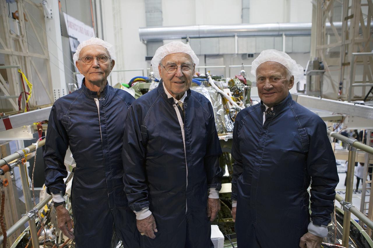CAPE CANAVERAL, Fla. -- At the Kennedy Space Center in Florida, Apollo astronauts tour the refurbished Operations and Checkout Building, newly named for Apollo 11 astronaut Neil Armstrong, the first person to set foot on the moon. Viewing the Orion crew module stacked on top of the service module from left, are Apollo 11 astronaut Michael Collins, Apollo astronaut Jim Lovell, and Apollo 11 astronaut Buzz Aldrin. The building's high bay is being used to support the agency's new Orion spacecraft, which will lift off atop the Space Launch System. Orion is designed to take humans farther than they've ever gone before, serving as the exploration vehicle that will carry astronauts to deep space and sustain the crew during travel to destinations such as an asteroid or Mars.    The visit of the former astronauts was part of NASA's 45th anniversary celebration of the moon landing. As the world watched, Neil Armstrong and Aldrin landed in the moon's Sea of Tranquility aboard the lunar module Eagle on July 20, 1969. Meanwhile, crewmate Collins orbited above in the command module Columbia. For more, visit http://www.nasa.gov/press/2014/july/nasa-honors-historic-first-moon-landing-eyes-first-mars-mission. Photo credit: NASA/Kim Shiflett