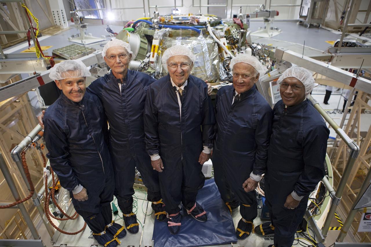 CAPE CANAVERAL, Fla. -- At the Kennedy Space Center in Florida, NASA officials and Apollo astronauts tour the refurbished Operations and Checkout Building, newly named for Apollo 11 astronaut Neil Armstrong, the first person to set foot on the moon. Viewing the Orion crew module stacked on top of the service module from left, are Kennedy Center Director Bob Cabana, Apollo 11 astronaut Michael Collins, Apollo astronaut Jim Lovell, Apollo 11 astronaut Buzz Aldrin, and NASA Administrator Charlie Bolden. The building's high bay is being used to support the agency's new Orion spacecraft, which will lift off atop the Space Launch System. Orion is designed to take humans farther than they've ever gone before, serving as the exploration vehicle that will carry astronauts to deep space and sustain the crew during travel to destinations such as an asteroid or Mars. The visit of the former astronauts was part of NASA's 45th anniversary celebration of the moon landing. As the world watched, Neil Armstrong and Aldrin landed in the moon's Sea of Tranquility aboard the lunar module Eagle on July 20, 1969. Meanwhile, crewmate Collins orbited above in the command module Columbia. For more, visit http://www.nasa.gov/press/2014/july/nasa-honors-historic-first-moon-landing-eyes-first-mars-mission. Photo credit: NASA/Kim Shiflett