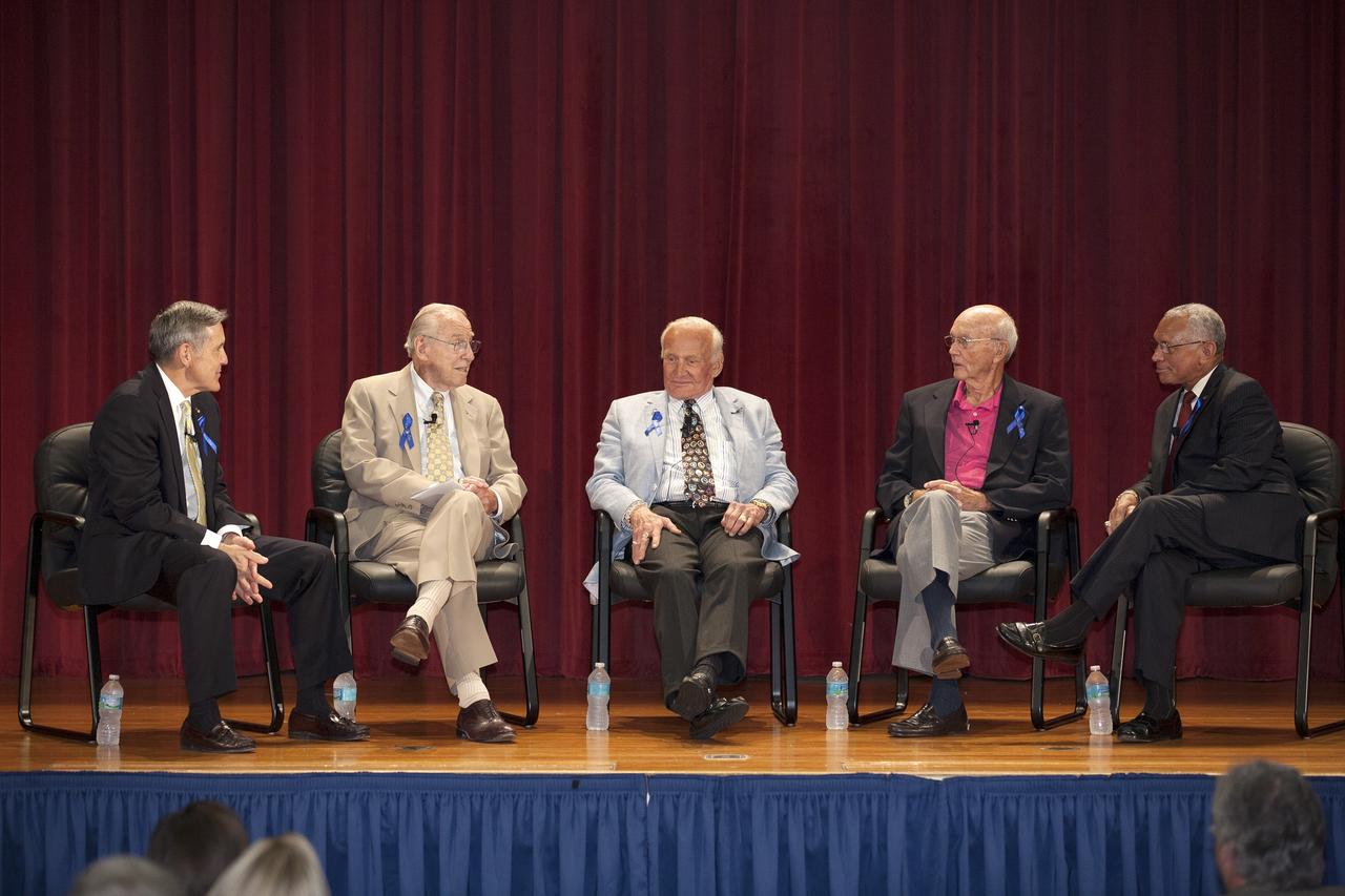 CAPE CANAVERAL, Fla. -- Apollo astronauts participate in a panel discussion held for employees in the KSC Training Auditorium at NASA's Kennedy Space Center in Florida. From left are Center Director Robert Cabana, Apollo 8 and Apollo 13 crew member Jim Lovell, Apollo 11 moonwalker Buzz Aldrin, Apollo 11 command module pilot Michael Collins, and NASA Administrator Charles Bolden. Cabana and Bolden, both shuttle astronauts, asked the questions to which the panel members responded. The panel discussion followed a ceremony renaming the refurbished Operations and Checkout Building for Apollo 11 astronaut Neil Armstrong, the first person to set foot on the moon. The building's high bay, the site for the ceremony, is being used to support the agency's new Orion spacecraft and is the same spaceport facility where the Apollo 11 command/service module and lunar module were prepped for the first lunar landing mission in 1969. Orion is designed to take humans farther than they’ve ever gone before, serving as the exploration vehicle that will carry astronauts to deep space and sustain the crew during travel to destinations such as an asteroid or Mars. The ceremony and panel discussion were part of NASA's 45th anniversary celebration of the Apollo 11 moon landing. As the world watched, Neil Armstrong and Buzz Aldrin landed in the moon's Sea of Tranquility on July 20, 1969, aboard the lunar module Eagle. Meanwhile, crewmate Michael Collins orbited above in the command module Columbia. For more, visit http://www.nasa.gov/press/2014/july/nasa-honors-historic-first-moon-landing-eyes-first-mars-mission. Photo credit: NASA/Kim Shiflett