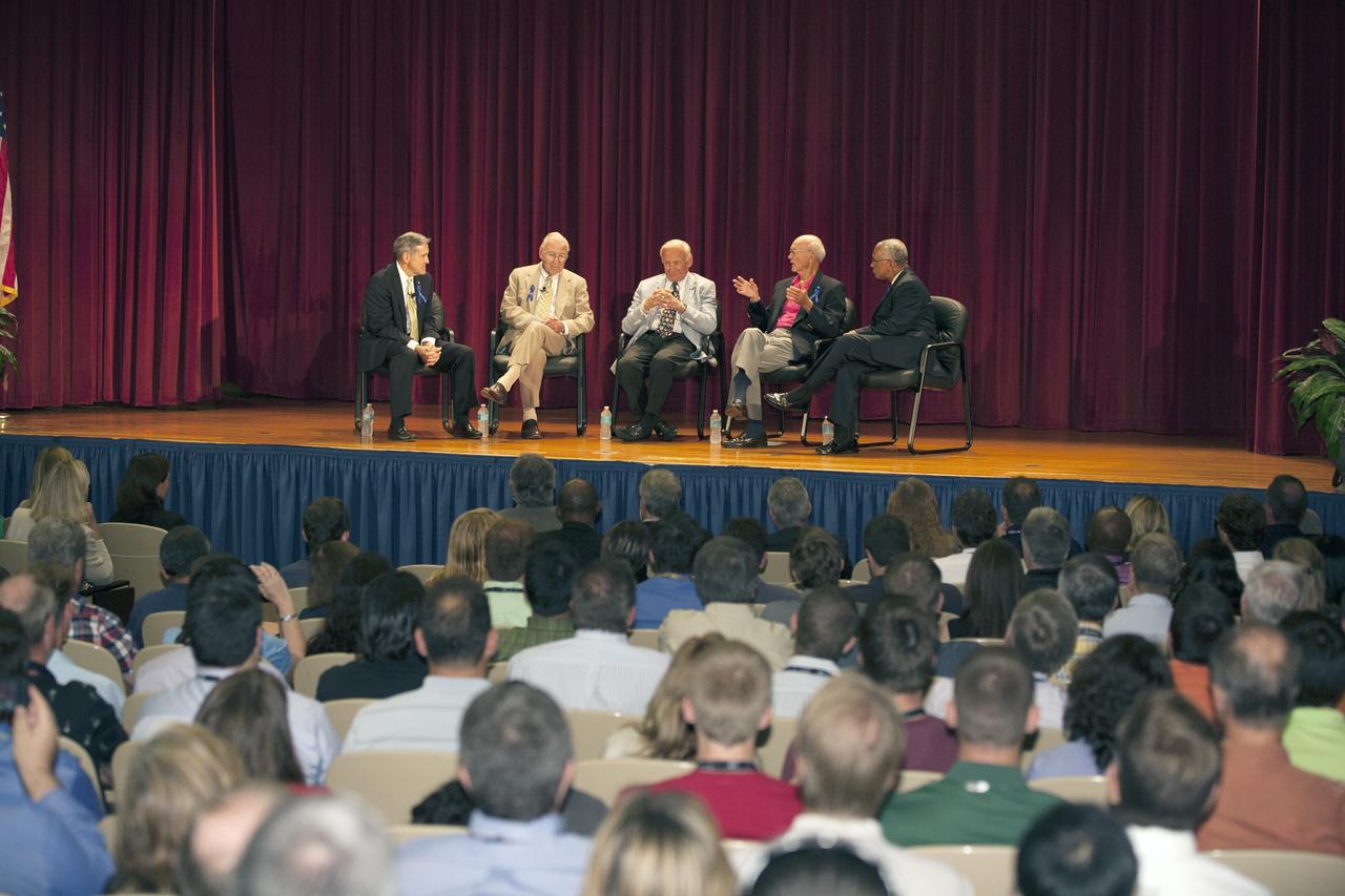 CAPE CANAVERAL, Fla. -- Apollo astronauts participate in a panel discussion held for employees in the KSC Training Auditorium at NASA's Kennedy Space Center in Florida. From left are Center Director Robert Cabana, Apollo 8 and Apollo 13 crew member Jim Lovell, Apollo 11 moonwalker Buzz Aldrin, Apollo 11 command module pilot Michael Collins, and NASA Administrator Charles Bolden. Cabana and Bolden, both shuttle astronauts, asked the questions to which the panel members responded. The panel discussion followed a ceremony renaming the refurbished Operations and Checkout Building for Apollo 11 astronaut Neil Armstrong, the first person to set foot on the moon. The building's high bay, the site for the ceremony, is being used to support the agency's new Orion spacecraft and is the same spaceport facility where the Apollo 11 command/service module and lunar module were prepped for the first lunar landing mission in 1969. Orion is designed to take humans farther than they’ve ever gone before, serving as the exploration vehicle that will carry astronauts to deep space and sustain the crew during travel to destinations such as an asteroid or Mars. The ceremony and panel discussion were part of NASA's 45th anniversary celebration of the Apollo 11 moon landing. As the world watched, Neil Armstrong and Buzz Aldrin landed in the moon's Sea of Tranquility on July 20, 1969, aboard the lunar module Eagle. Meanwhile, crewmate Michael Collins orbited above in the command module Columbia. For more, visit http://www.nasa.gov/press/2014/july/nasa-honors-historic-first-moon-landing-eyes-first-mars-mission. Photo credit: NASA/Kim Shiflett