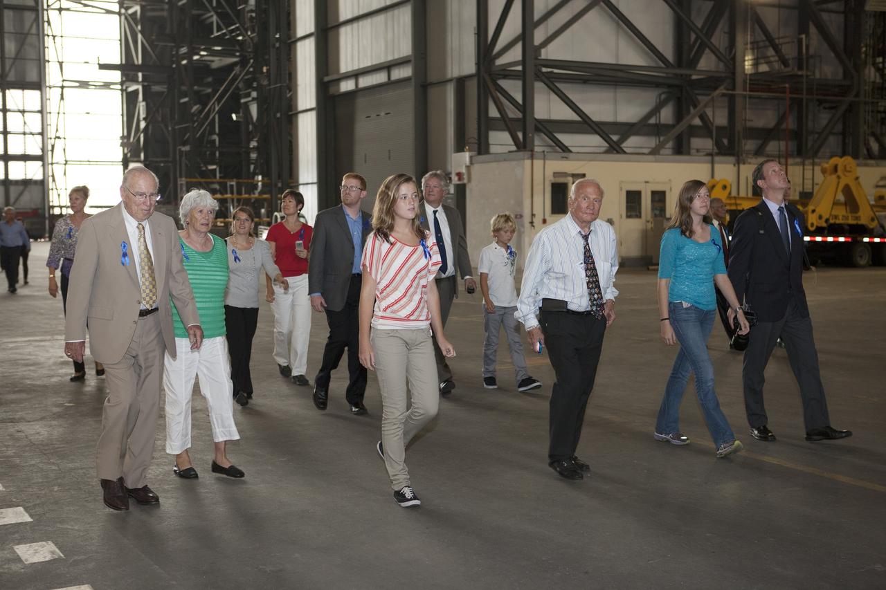 CAPE CANAVERAL, Fla. -- Apollo astronauts and their families tour the Vehicle Assembly Building, the facility in which Apollo's Saturn V rockets were processed at NASA's Kennedy Space Center in Florida. The tour followed a ceremony renaming the refurbished Operations and Checkout Building for Apollo 11 astronaut Neil Armstrong, the first person to set foot on the moon. Leading the way through the transfer aisle, from left, are Apollo astronaut Jim Lovell, Neil's former wife Janet, Neil's granddaughter Lily, and Apollo 11 moonwalker Buzz Aldrin.    The ceremony was part of NASA's 45th anniversary celebration of the Apollo 11 moon landing. As the world watched, Neil Armstrong and Buzz Aldrin landed in the moon's Sea of Tranquility on July 20, 1969, aboard the lunar module Eagle. Meanwhile, crewmate Michael Collins orbited above in the command module Columbia. For more, visit http://www.nasa.gov/press/2014/july/nasa-honors-historic-first-moon-landing-eyes-first-mars-mission.  Photo credit: NASA/Kim Shiflett
