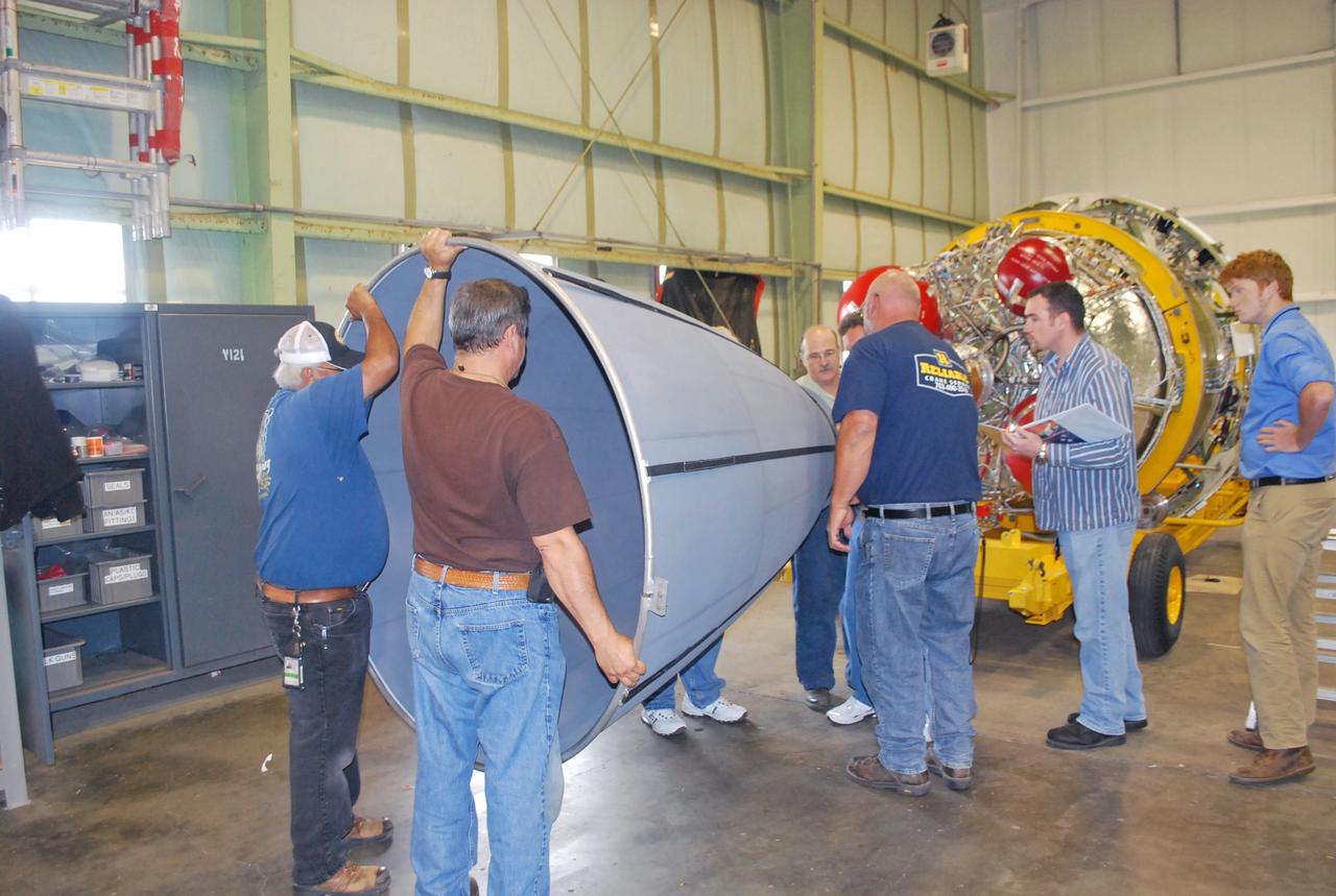 VANDENBERG AIR FORCE BASE, Calif. – Workers align the nozzle with the second stage of the United Launch Alliance Delta II rocket in the Horizontal Processing Facility at Space Launch Complex 2 on Vandenberg Air Force Base in California.      The Delta II will be used to loft NASA's Soil Moisture Active Passive mission, or SMAP, into orbit. The spacecraft will provide global measurements of soil moisture and its freeze/thaw state. These measurements will be used to enhance understanding of processes that link the water, energy and carbon cycles, and to extend the capabilities of weather and climate prediction models. The data returned also will be used to quantify net carbon flux in boreal landscapes and to develop improved flood prediction and drought monitoring capabilities. Launch is scheduled for November 2014. To learn more about SMAP, visit http://smap.jpl.nasa.gov.  Photo credit: NASA/Randy Beaudoin