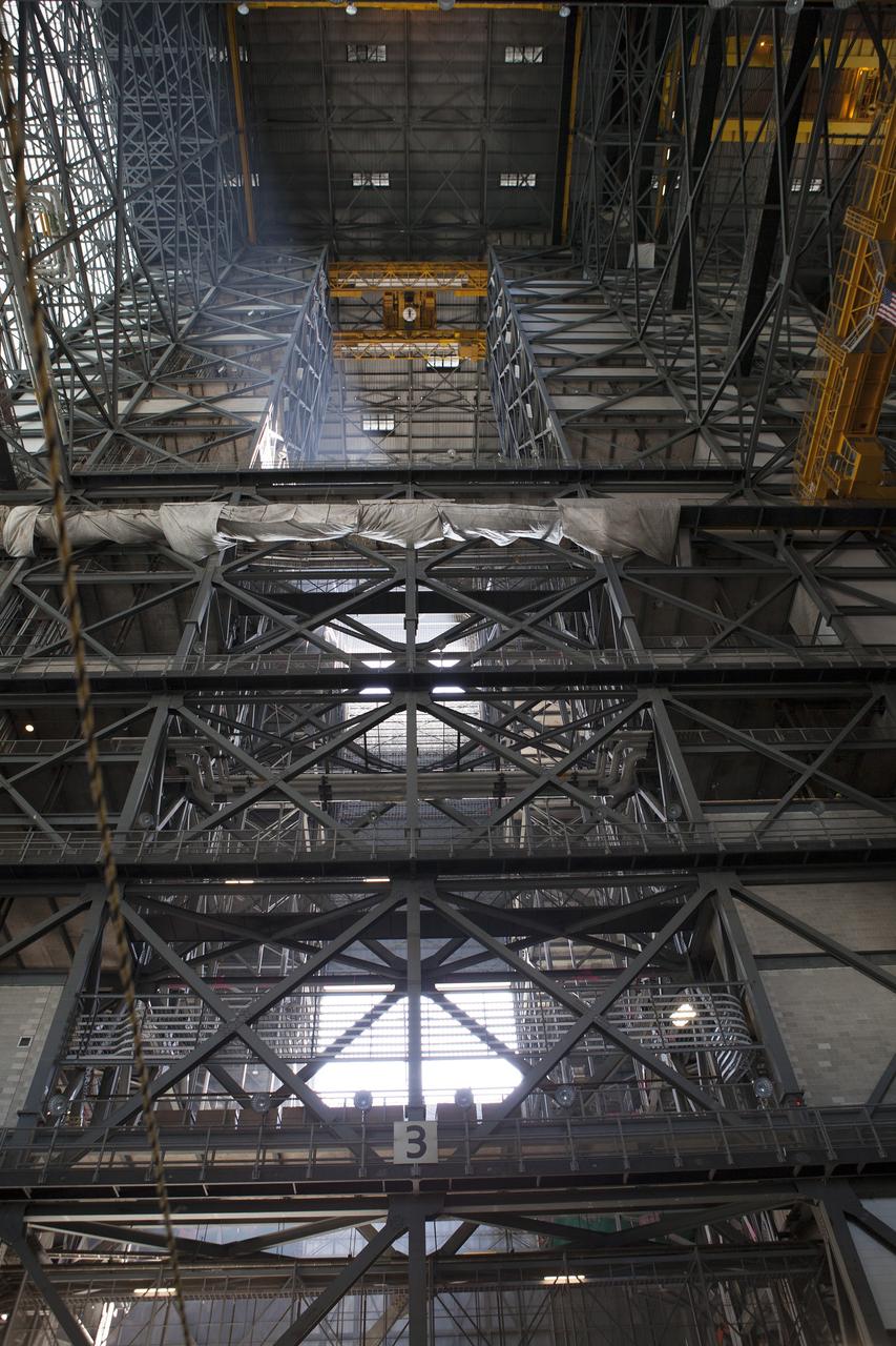CAPE CANAVERAL, Fla. – A view looking up from the ground level inside the Vehicle Assembly Building, or VAB, at NASA’s Kennedy Space Center in Florida. High above is the 175-ton crane. Modifications are underway inside the VAB to prepare High Bay 3 for a new platform system. The modifications are part of a centerwide refurbishment initiative under the Ground Systems Development and Operations Program. High bay 3 is being refurbished to accommodate NASA’s Space Launch System and a variety of other spacecraft. For more information, visit http://www.nasa.gov/exploration/systems/ground/index.html. Photo credit: NASA/Dimitri Gerondidakis