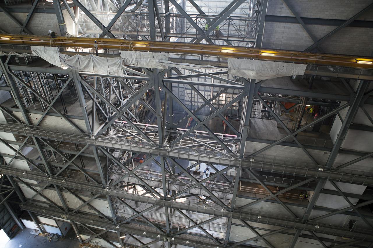 CAPE CANAVERAL, Fla. – Inside the Vehicle Assembly Building, or VAB, at NASA’s Kennedy Space Center in Florida, protective cloths are being placed around a work level near High Bay 3. Modifications are underway in the VAB to prepare High Bay 3 for a new platform system. The modifications are part of a centerwide refurbishment initiative under the Ground Systems Development and Operations Program. High bay 3 is being refurbished to accommodate NASA’s Space Launch System and a variety of other spacecraft. For more information, visit http://www.nasa.gov/exploration/systems/ground/index.html. Photo credit: NASA/Dimitri Gerondidakis