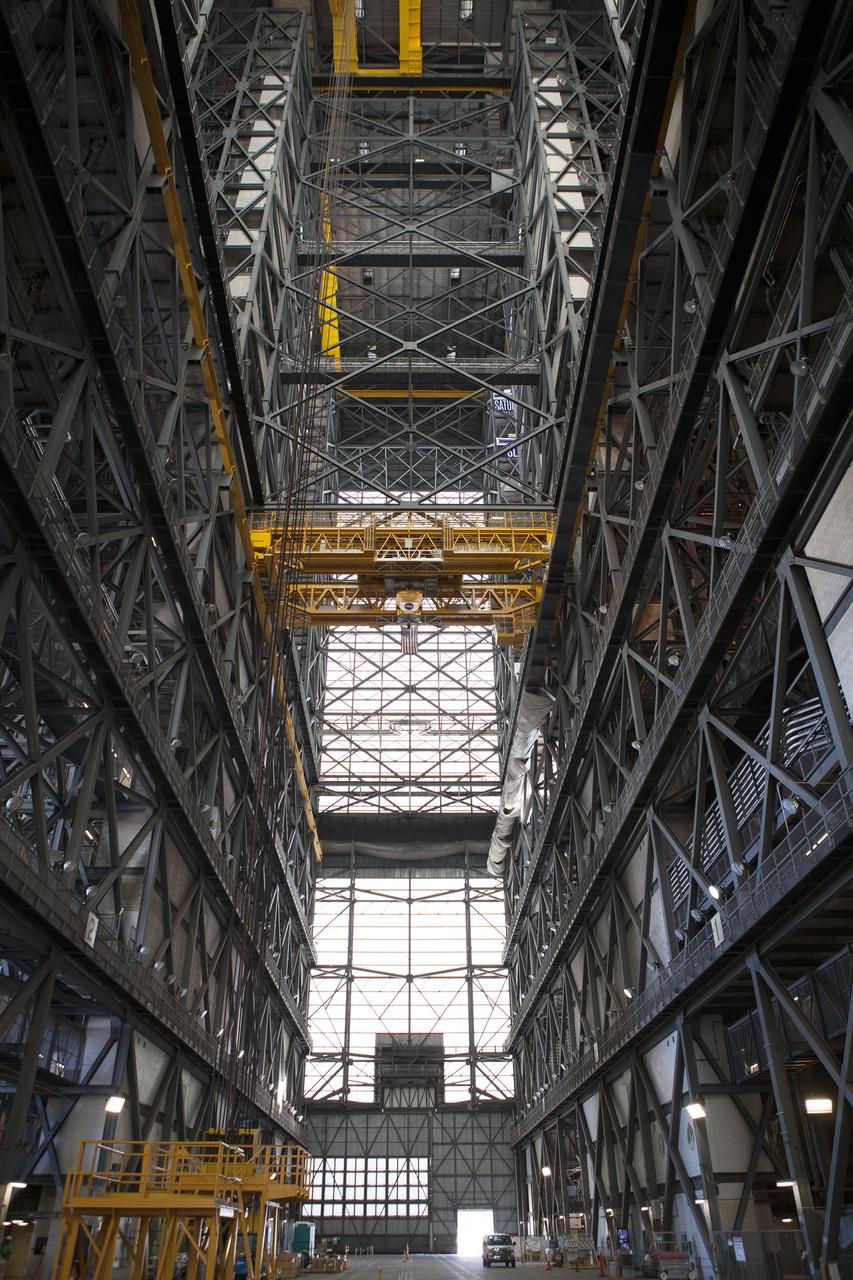CAPE CANAVERAL, Fla. – A view looking down the transfer aisle inside the Vehicle Assembly Building at NASA’s Kennedy Space Center in Florida. In view above is the 175-ton crane. Modifications are underway in the VAB to prepare High Bay 3 for a new platform system. The modifications are part of a centerwide refurbishment initiative under the Ground Systems Development and Operations Program. High bay 3 is being refurbished to accommodate NASA’s Space Launch System and a variety of other spacecraft. For more information, visit http://www.nasa.gov/exploration/systems/ground/index.html. Photo credit: NASA/Dimitri Gerondidakis
