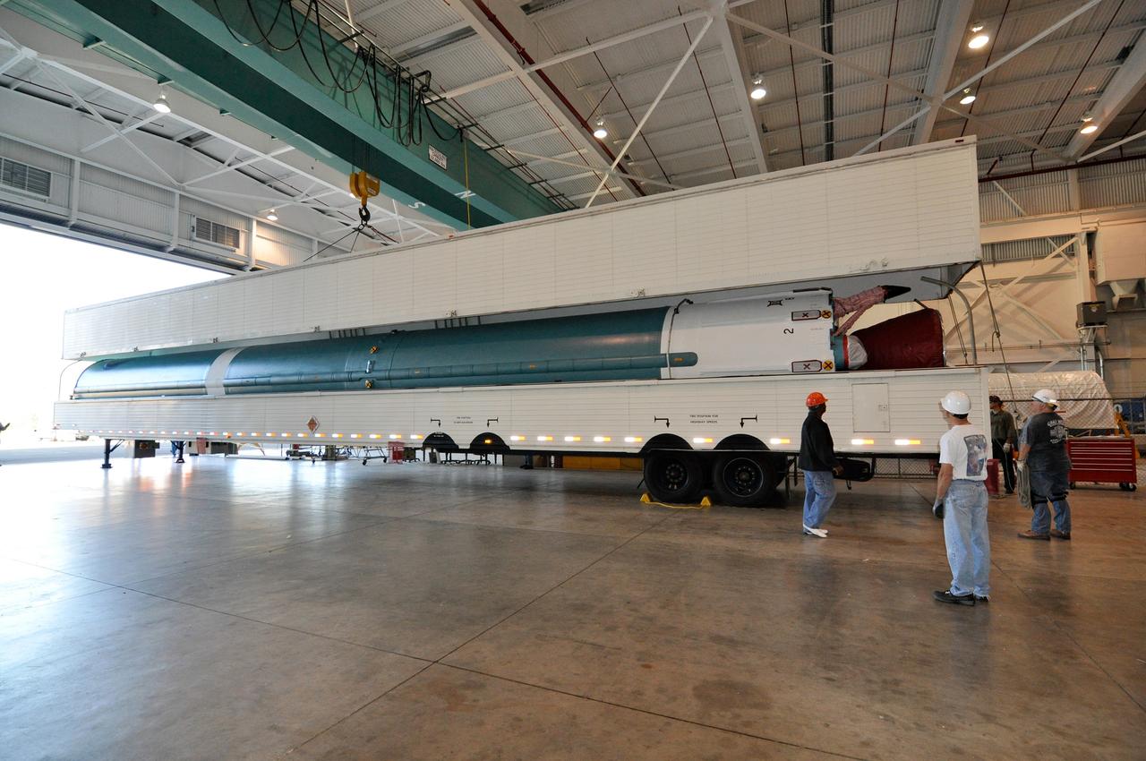 VANDENBERG AIR FORCE BASE, Calif. – The first stage of a United Launch Alliance Delta II rocket arrives at NASA hangar 836 on Vandenberg Air Force Base in California. The Delta II rocket will be used to deliver NASA's Soil Moisture Active Passive mission, or SMAP, into orbit.      SMAP will provide global measurements of soil moisture and its freeze/thaw state. These measurements will be used to enhance understanding of processes that link the water, energy and carbon cycles, and to extend the capabilities of weather and climate prediction models. SMAP data also will be used to quantify net carbon flux in boreal landscapes and to develop improved flood prediction and drought monitoring capabilities. Launch is scheduled for November 2014. To learn more about SMAP, visit http://smap.jpl.nasa.gov Photo credit: NASA/Randy Beaudoin