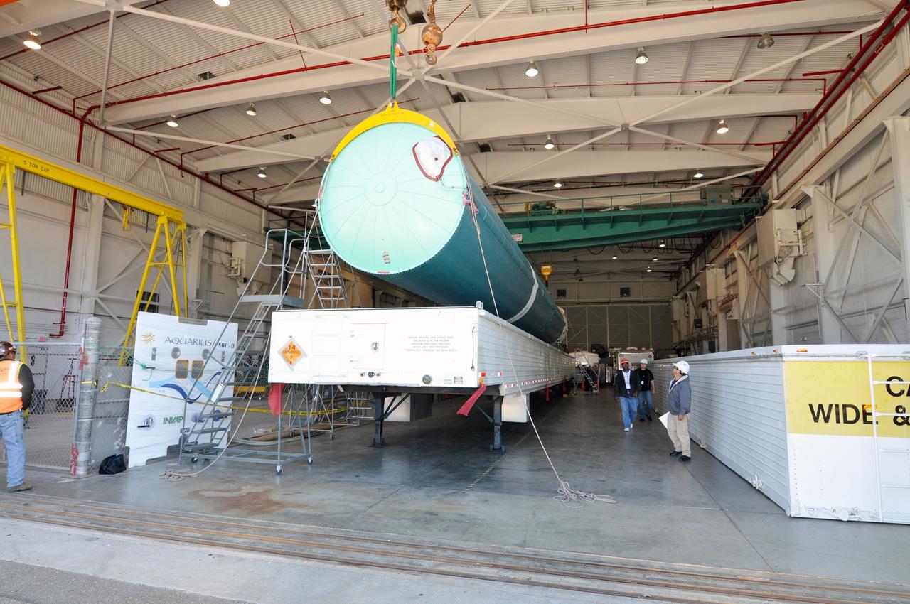 VANDENBERG AIR FORCE BASE, Calif. – A crane is used to offload the first stage of a United Launch Alliance Delta II rocket following its arrival at NASA hangar 836 on Vandenberg Air Force Base in California. The launch vehicle will be used to deliver NASA's Soil Moisture Active Passive mission, or SMAP, into orbit. SMAP will provide global measurements of soil moisture and its freeze/thaw state. These measurements will be used to enhance understanding of processes that link the water, energy and carbon cycles, and to extend the capabilities of weather and climate prediction models. SMAP data also will be used to quantify net carbon flux in boreal landscapes and to develop improved flood prediction and drought monitoring capabilities. Launch is scheduled for November 2014. To learn more about SMAP, visit http://smap.jpl.nasa.gov Photo credit: NASA/Randy Beaudoin