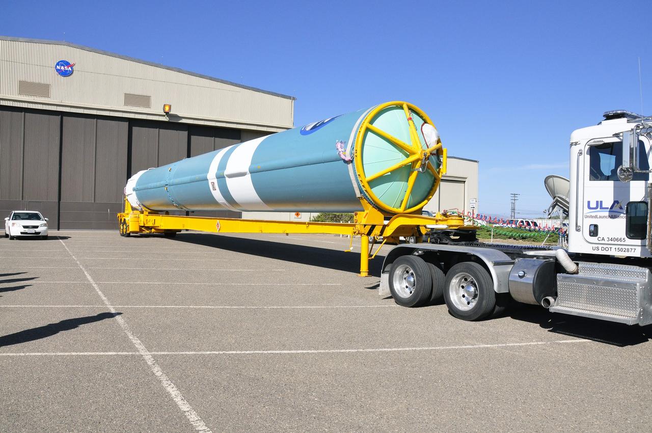 VANDENBERG AIR FORCE BASE, Calif. – The first stage of the United Launch Alliance Delta II rocket for NASA's Soil Moisture Active Passive mission, or SMAP, begins its journey from the Building 836 hangar to the Horizontal Processing Facility at Space Launch Complex 2 on Vandenberg Air Force Base in California. SMAP will provide global measurements of soil moisture and its freeze/thaw state. These measurements will be used to enhance understanding of processes that link the water, energy and carbon cycles, and to extend the capabilities of weather and climate prediction models. SMAP data also will be used to quantify net carbon flux in boreal landscapes and to develop improved flood prediction and drought monitoring capabilities. Launch is scheduled for November 2014. To learn more about SMAP, visit http://smap.jpl.nasa.gov. Photo credit: NASA/Randy Beaudoin