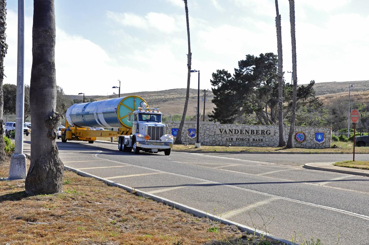 VANDENBERG AIR FORCE BASE, Calif. – The first stage of the United Launch Alliance Delta II rocket for NASA's Soil Moisture Active Passive mission, or SMAP, makes its way along the roadways on Vandenberg Air Force Base in California from the Building 836 hangar to the Horizontal Processing Facility at Space Launch Complex 2.    SMAP will provide global measurements of soil moisture and its freeze/thaw state. These measurements will be used to enhance understanding of processes that link the water, energy and carbon cycles, and to extend the capabilities of weather and climate prediction models. SMAP data also will be used to quantify net carbon flux in boreal landscapes and to develop improved flood prediction and drought monitoring capabilities. Launch is scheduled for November 2014. To learn more about SMAP, visit http://smap.jpl.nasa.gov.  Photo credit: NASA/Randy Beaudoin