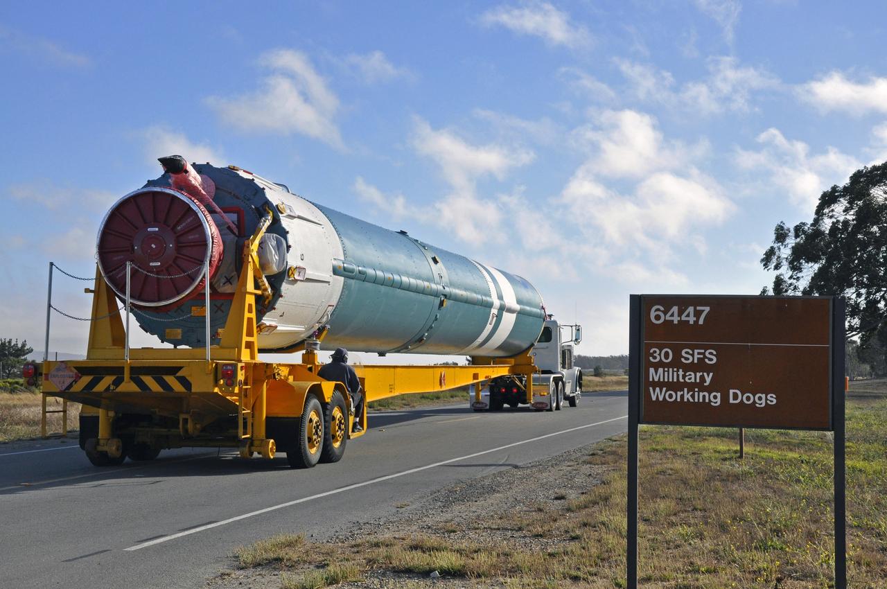 VANDENBERG AIR FORCE BASE, Calif. – The U.S. Air Force 30th Security Forces Squadron is responsible for the safety of the first stage of the United Launch Alliance Delta II rocket for NASA's Soil Moisture Active Passive mission, or SMAP, on its move from the Building 836 hangar to the Horizontal Processing Facility at Space Launch Complex 2 on Vandenberg Air Force Base in California.    SMAP will provide global measurements of soil moisture and its freeze/thaw state. These measurements will be used to enhance understanding of processes that link the water, energy and carbon cycles, and to extend the capabilities of weather and climate prediction models. SMAP data also will be used to quantify net carbon flux in boreal landscapes and to develop improved flood prediction and drought monitoring capabilities. Launch is scheduled for November 2014. To learn more about SMAP, visit http://smap.jpl.nasa.gov.  Photo credit: NASA/Randy Beaudoin