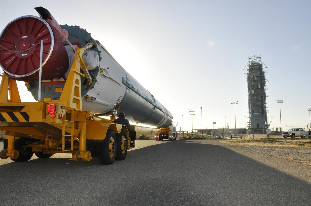 VANDENBERG AIR FORCE BASE, Calif. – The first stage of the United Launch Alliance Delta II rocket for NASA's Soil Moisture Active Passive mission, or SMAP, passes the mobile service tower at Space Launch Complex 2 on its way to the Horizontal Processing Facility on Vandenberg Air Force Base in California.      SMAP will provide global measurements of soil moisture and its freeze/thaw state. These measurements will be used to enhance understanding of processes that link the water, energy and carbon cycles, and to extend the capabilities of weather and climate prediction models. SMAP data also will be used to quantify net carbon flux in boreal landscapes and to develop improved flood prediction and drought monitoring capabilities. Launch is scheduled for November 2014. To learn more about SMAP, visit http://smap.jpl.nasa.gov.  Photo credit: NASA/Randy Beaudoin