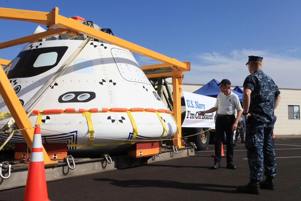 SAN DIEGO, Calif. – At the U.S. Naval Base San Diego in California, NASA's Orion boilerplate test vehicle is on display during an outreach event at the naval base. The USS Anchorage is being prepared for the Orion Underway Recovery Test 2. The Orion boilerplate test vehicle and other hardware will be loaded into the well deck of the ship and head out to sea in the Pacific Ocean off the coast of San Diego. NASA, Lockheed Martin and the U.S. Navy will conduct the test to prepare for recovery of the Orion crew module, forward bay cover and parachutes on its return from a deep space mission. The underway recovery test will allow the teams to demonstrate and evaluate the recovery processes, procedures, new support hardware and personnel in open waters.    The Ground Systems Development and Operations Program will conduct the underway recovery tests. Orion is the exploration spacecraft designed to carry astronauts to destinations not yet explored by humans, including an asteroid and Mars. It will have emergency abort capability, sustain the crew during space travel and provide safe re-entry from deep space return velocities. The first unpiloted test flight of the Orion is scheduled to launch in 2014 atop a Delta IV rocket and in 2017 on NASA’s Space Launch System rocket. For more information, visit http://www.nasa.gov/orion. Photo credit: NASA/Kim Shiflett