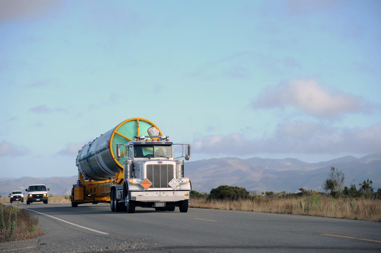 VANDENBERG AIR FORCE BASE, Calif. – The first stage of the United Launch Alliance Delta II rocket for NASA's Soil Moisture Active Passive mission, or SMAP, makes its way along the roadways on Vandenberg Air Force Base in California from the Building 836 hangar to the Horizontal Processing Facility at Space Launch Complex 2.    SMAP will provide global measurements of soil moisture and its freeze/thaw state. These measurements will be used to enhance understanding of processes that link the water, energy and carbon cycles, and to extend the capabilities of weather and climate prediction models. SMAP data also will be used to quantify net carbon flux in boreal landscapes and to develop improved flood prediction and drought monitoring capabilities. Launch is scheduled for November 2014. To learn more about SMAP, visit http://smap.jpl.nasa.gov.  Photo credit: NASA/U.S. Air Force 30th Space Wing