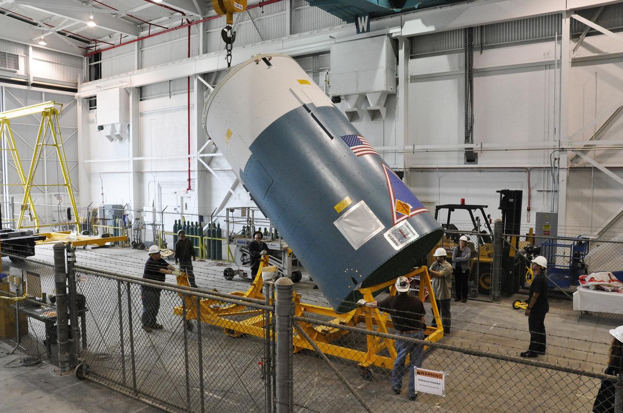 VANDENBERG AIR FORCE BASE, Calif. – Slowly and carefully, the Delta II interstage adapter, or ISA, for NASA's Soil Moisture Active Passive mission, or SMAP, is raised into a vertical position in the Building 836 hangar on south Vandenberg Air Force Base in California during preparations for its move to the pad.      A United Launch Alliance Delta II rocket will loft SMAP into orbit from Vandenberg's Space Launch Complex 2. The ISA connects the Delta II first and second stages and encloses the second stage engine and thrust section. The spacecraft will provide global measurements of soil moisture and its freeze/thaw state. These measurements will be used to enhance understanding of processes that link the water, energy and carbon cycles, and to extend the capabilities of weather and climate prediction models. The data returned also will be used to quantify net carbon flux in boreal landscapes and to develop improved flood prediction and drought monitoring capabilities. Launch is scheduled for November 2014. To learn more about SMAP, visit http://smap.jpl.nasa.gov.  Photo credit: NASA/Randy Beaudoin