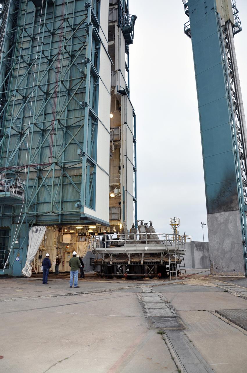 VANDENBERG AIR FORCE BASE, Calif. – Workers oversee the rollback of the mobile service tower at Space Launch Complex 2 on Vandenberg Air Force Base in California in preparation for the arrival of the first stage of the United Launch Alliance Delta II rocket for NASA's Soil Moisture Active Passive mission, or SMAP.    SMAP will provide global measurements of soil moisture and its freeze/thaw state. These measurements will be used to enhance understanding of processes that link the water, energy and carbon cycles, and to extend the capabilities of weather and climate prediction models. SMAP data also will be used to quantify net carbon flux in boreal landscapes and to develop improved flood prediction and drought monitoring capabilities. Launch is scheduled for November 2014. To learn more about SMAP, visit http://smap.jpl.nasa.gov.  Photo credit: NASA/Randy Beaudoin