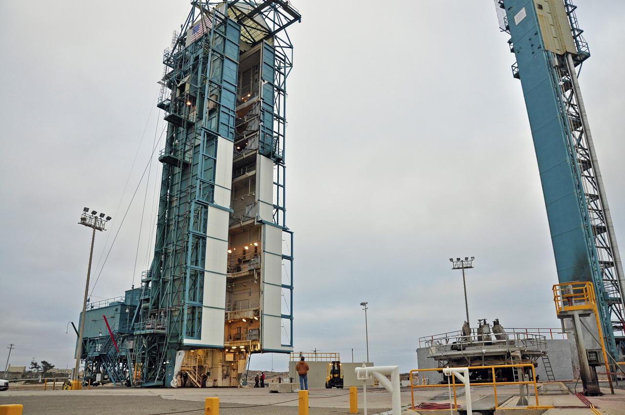 VANDENBERG AIR FORCE BASE, Calif. – The mobile service tower at Space Launch Complex 2 on Vandenberg Air Force Base in California is rolled back in preparation for the arrival of the first stage of the United Launch Alliance Delta II rocket for NASA's Soil Moisture Active Passive mission, or SMAP.    SMAP will provide global measurements of soil moisture and its freeze/thaw state. These measurements will be used to enhance understanding of processes that link the water, energy and carbon cycles, and to extend the capabilities of weather and climate prediction models. SMAP data also will be used to quantify net carbon flux in boreal landscapes and to develop improved flood prediction and drought monitoring capabilities. Launch is scheduled for November 2014. To learn more about SMAP, visit http://smap.jpl.nasa.gov.  Photo credit: NASA/Randy Beaudoin