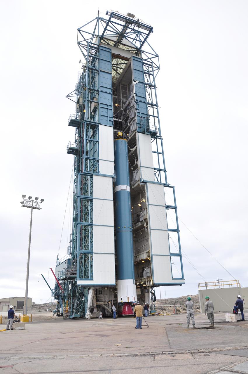 VANDENBERG AIR FORCE BASE, Calif. – A crane transfers the first stage of the United Launch Alliance Delta II rocket for NASA's Soil Moisture Active Passive mission, or SMAP, into the mobile service tower at Space Launch Complex 2 on Vandenberg Air Force Base in California.    SMAP will provide global measurements of soil moisture and its freeze/thaw state. These measurements will be used to enhance understanding of processes that link the water, energy and carbon cycles, and to extend the capabilities of weather and climate prediction models. SMAP data also will be used to quantify net carbon flux in boreal landscapes and to develop improved flood prediction and drought monitoring capabilities. Launch is scheduled for November 2014. To learn more about SMAP, visit http://smap.jpl.nasa.gov.  Photo credit: NASA/Randy Beaudoin