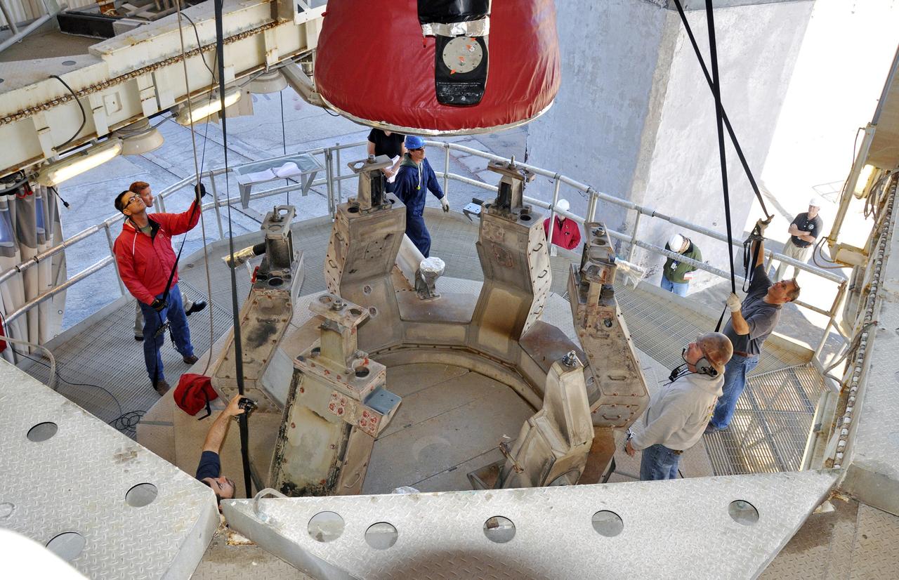 VANDENBERG AIR FORCE BASE, Calif. – Workers guide the first stage of the United Launch Alliance Delta II rocket for NASA's Soil Moisture Active Passive mission, or SMAP, onto the launcher adjacent to the fixed umbilical tower at Space Launch Complex 2 on Vandenberg Air Force Base in California.    SMAP will provide global measurements of soil moisture and its freeze/thaw state. These measurements will be used to enhance understanding of processes that link the water, energy and carbon cycles, and to extend the capabilities of weather and climate prediction models. SMAP data also will be used to quantify net carbon flux in boreal landscapes and to develop improved flood prediction and drought monitoring capabilities. Launch is scheduled for November 2014. To learn more about SMAP, visit http://smap.jpl.nasa.gov.  Photo credit: NASA/Randy Beaudoin