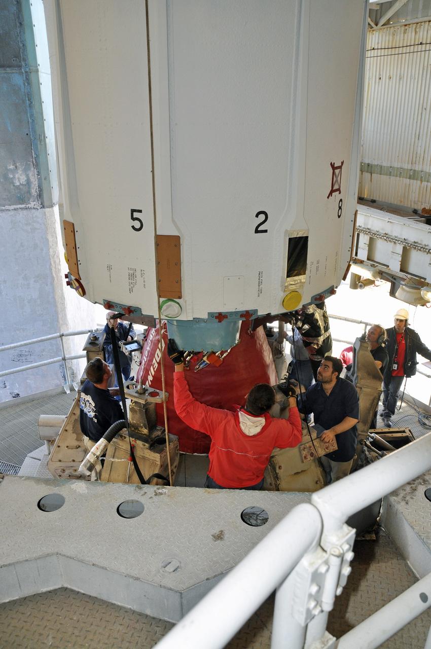 VANDENBERG AIR FORCE BASE, Calif. – Workers secure the first stage of the United Launch Alliance Delta II rocket for NASA's Soil Moisture Active Passive mission, or SMAP, onto the launch stand at Space Launch Complex 2 on Vandenberg Air Force Base in California.    SMAP will provide global measurements of soil moisture and its freeze/thaw state. These measurements will be used to enhance understanding of processes that link the water, energy and carbon cycles, and to extend the capabilities of weather and climate prediction models. SMAP data also will be used to quantify net carbon flux in boreal landscapes and to develop improved flood prediction and drought monitoring capabilities. Launch is scheduled for November 2014. To learn more about SMAP, visit http://smap.jpl.nasa.gov.  Photo credit: NASA/Randy Beaudoin