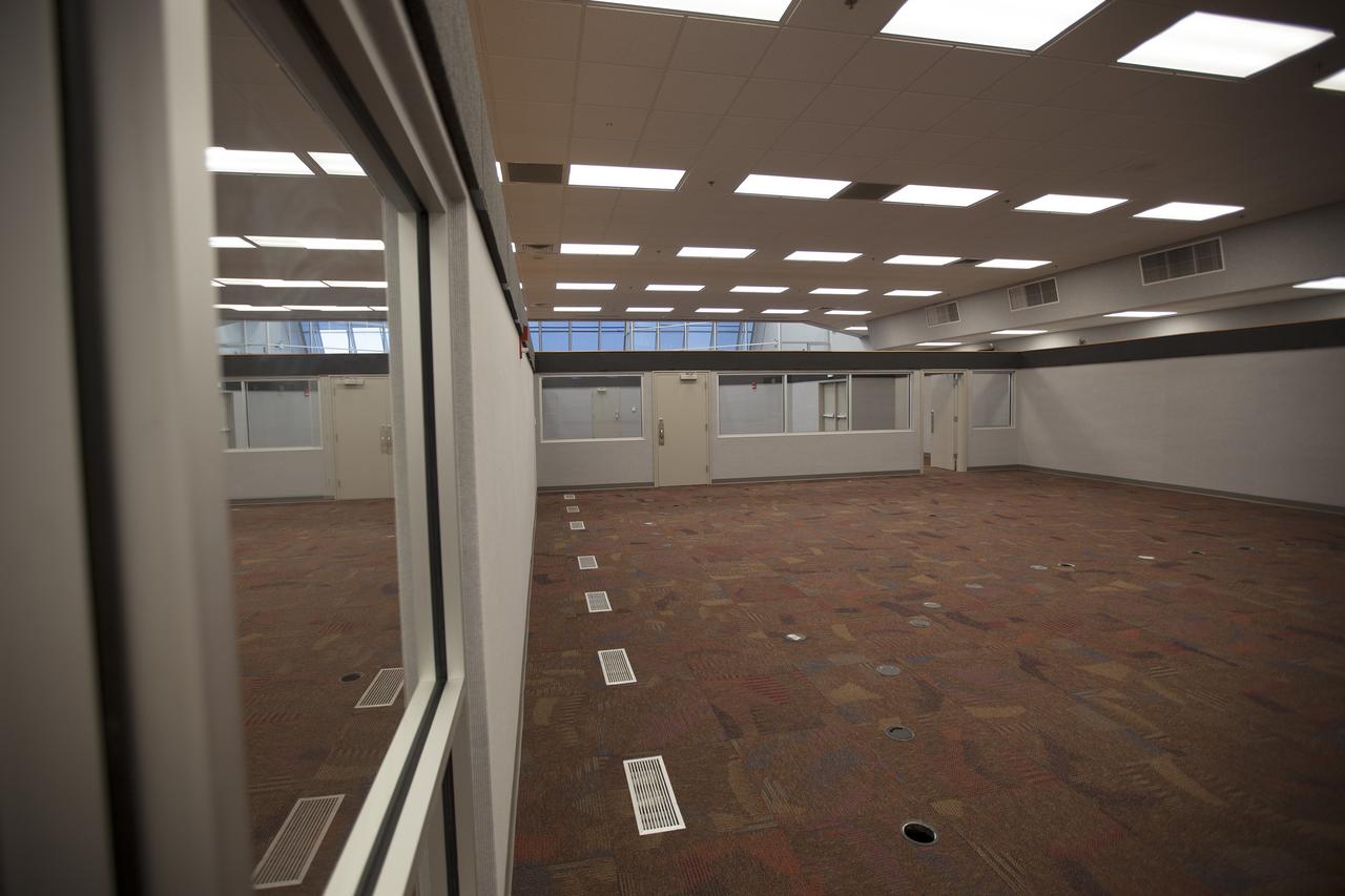 CAPE CANAVERAL, Fla. – Inside Firing Room 4 in the Launch Control Center at NASA's Kennedy Space Center in Florida, the inner walls, outer walls, windows and doors have been completed for the four individual firing rooms. New ceiling tiles, lighting and carpeting have been installed. Three rows of upper level management consoles remain and could be used as a fifth firing room. The Ground Systems Development and Operations Program is overseeing the efforts to create a new firing room based on a multi-user concept.    The design of Firing Room 4 incorporates five control room areas that can be flexible to meet current and future NASA and commercial user requirements. The equipment and most of the consoles from Firing Room 4 were moved to Firing Room 2 for possible future reuse. Photo credit: NASA/Dimitri Gerondidakis