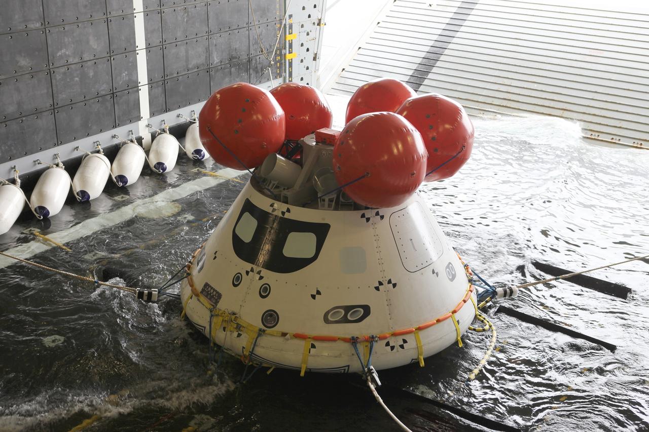 SAN DIEGO, Calif. – Water fills the well deck of the U.S. Navy’s USS Anchorage around the Orion boilerplate test vehicle in preparation for a portion of Underway Recovery Test 2 in the Pacific Ocean off the coast of San Diego. The test vehicle has been moved from its cradle onto a set of rubber shock absorbers. Testing of the tether lines attached to Orion is underway. NASA, Lockheed Martin and the U.S. Navy are conducting the test to prepare for recovery of the Orion crew module on its return from a deep space mission. The underway recovery test will allow the team to demonstrate and evaluate the recovery processes, procedures, new hardware and personnel in open waters.     The Ground Systems Development and Operations Program is conducting the underway recovery test. Orion is the exploration spacecraft designed to carry astronauts to destinations not yet explored by humans, including an asteroid and Mars. It will have emergency abort capability, sustain the crew during space travel and provide safe re-entry from deep space return velocities. The first unpiloted test flight of the Orion is scheduled to launch in 2014 atop a Delta IV rocket and in 2017 on NASA’s Space Launch System rocket. For more information, visit http://www.nasa.gov/orion. Photo credit: NASA/Kim Shiflett